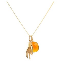18K Gold Mudra Amulet + Ruby Root Chakra Pendant Necklace by Elizabeth Raine