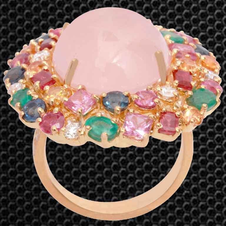 This gorgeous ring is a colorful and beautiful design, assorted with multicolored Emeralds, Rubies and Sapphires with Rose Quarts.
This ring has Rubies 1.49 carats, Emeralds 0.86 carats, Sapphires 2.67 carats and white round cut diamonds 0.39