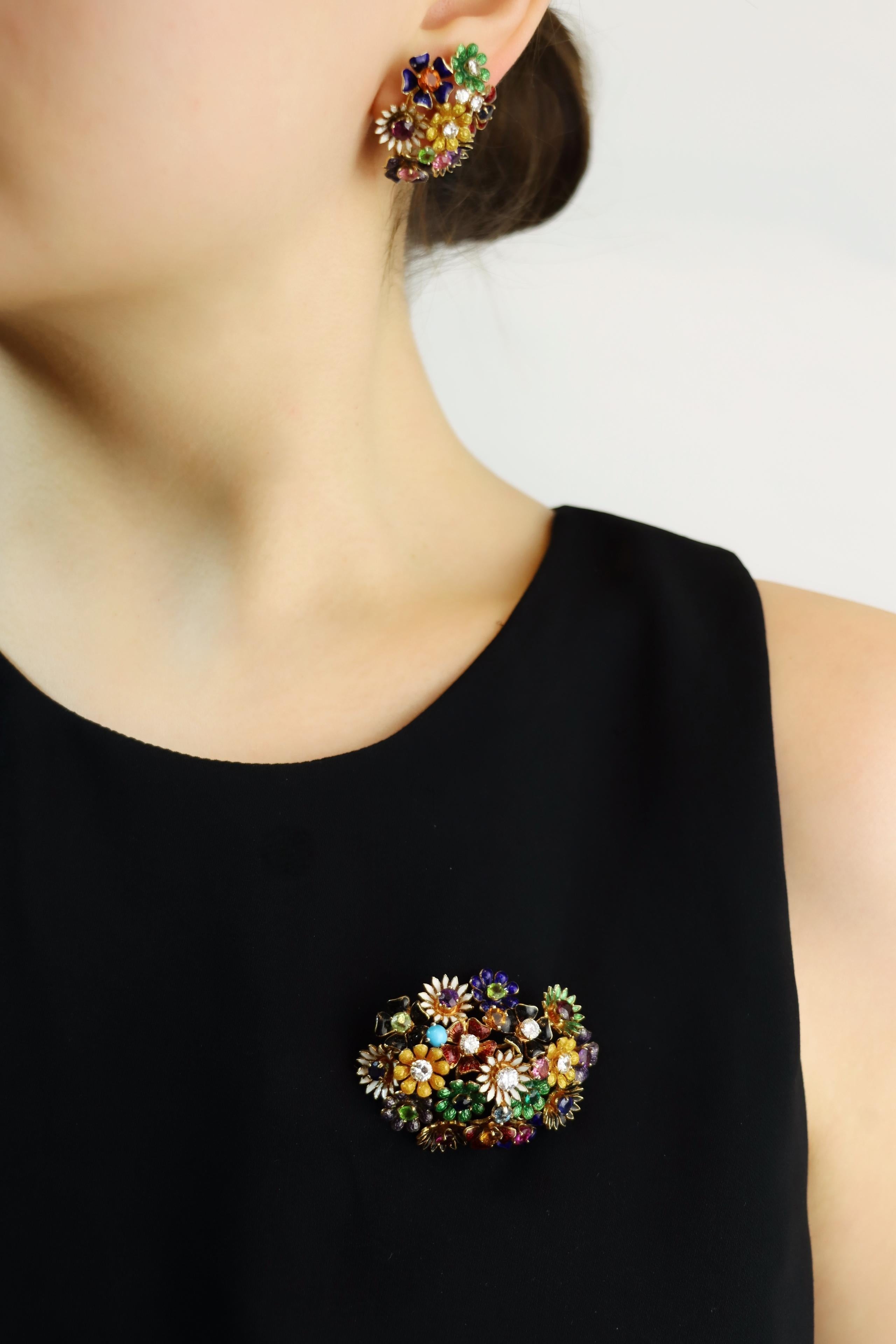 18K Gold Muti-Gem Enamel Flower Earring
18K Gold, Diamond, Ruby, Sapphire, Emerald, Turquoise and more.


Yellow Gold - 18KT
White Gold Stud Backs - 14KT

Approximate Dimensions:
3.2 cm (Length) 
2.5 cm (Width)
19.9 grams in weight.