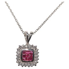 Collana bifronte decorata con diamanti naturali e rubini taglio baguette in oro 18k
