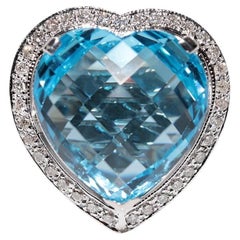 Bague en or 18 carats ornée d'un diamant naturel et d'une topaze bleue en forme de coeur fort