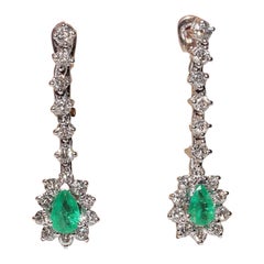 Orecchino con diamante naturale e smeraldo decorato in oro 18k