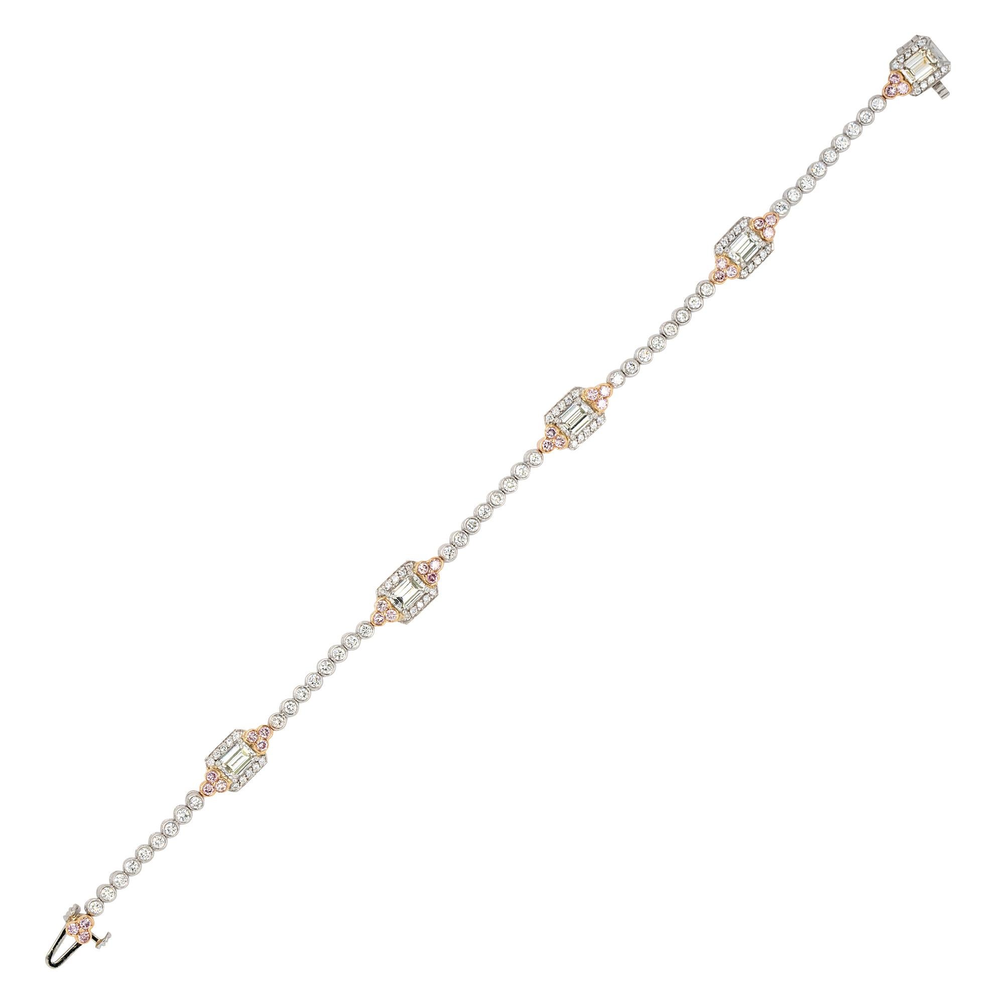 Material: 18k white gold
Diamonds Details: 1.97ctw of Natural G color and VS clarity Emerald cuts
1.26ctw of Natural Round Brilliants G color and VS clarity
0.55ctw of Natural Fancy Pink Round Brilliants.
Bracelet Measurements	7