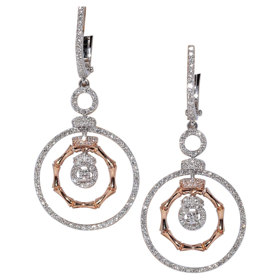Boucles d
oreilles pendantes en or 18 carats ornées de diamants naturels de forme ronde