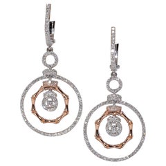 Boucles d
oreilles pendantes en or 18 carats ornées de diamants naturels de forme ronde
