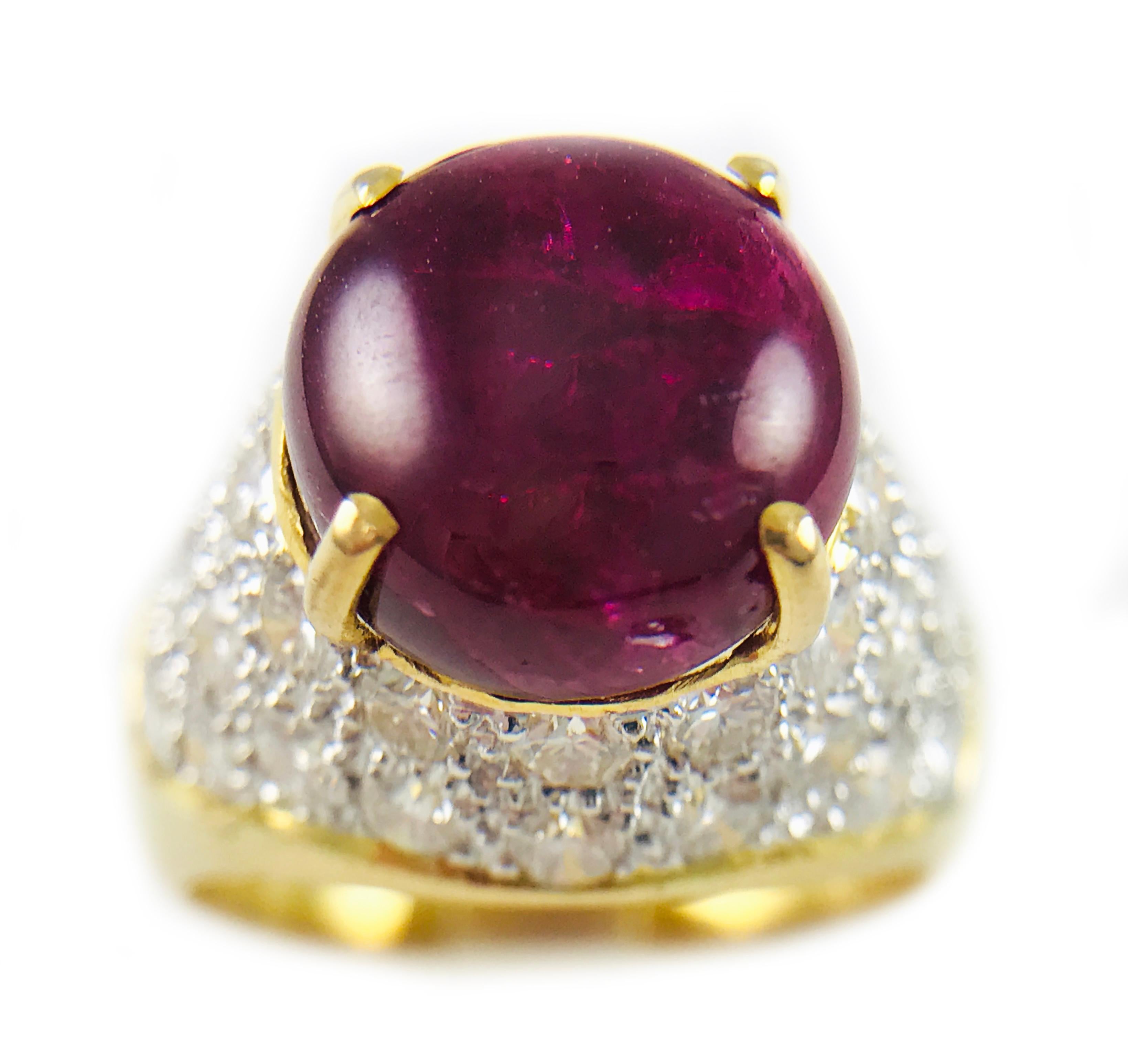 18 Karat Yellow and White Gold Natural Ruby Cabochon Diamond Pavé Ring, Circa 1995. Gorgeous medium color natural Ruby cabochon with thirty-six round pavé set diamonds set in 14k white gold. According to story this ring was a gift from the King of