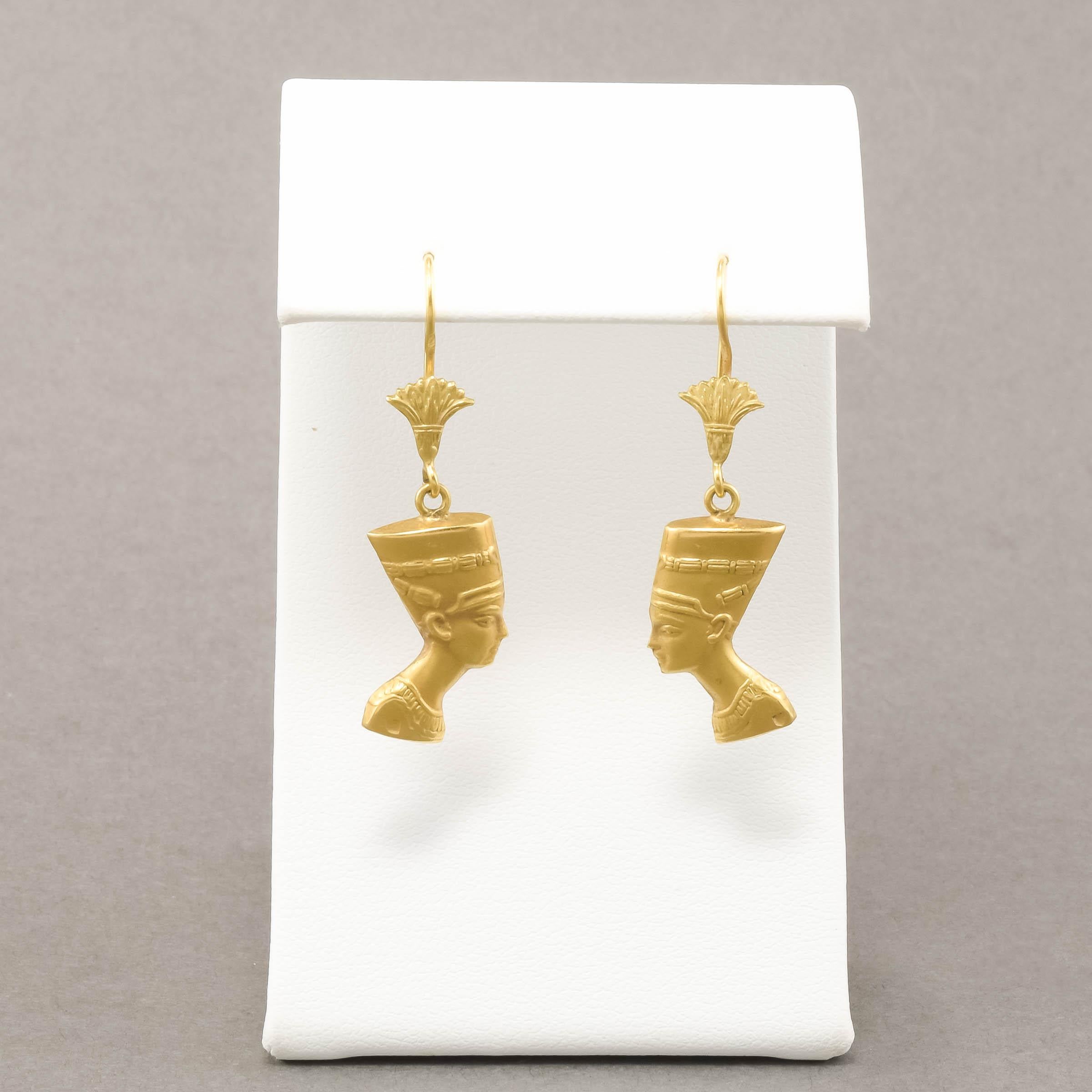 Beautifully designed and made, these elegant Nefertiti earrings are the nicest I've come across.  I especially love the lotus flower details on the ear wires.

Crafted of richly hued gold testing at 18K gold or a little higher, the earrings features