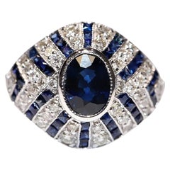 Bague en or 18k de fabrication récente ornée de diamants naturels et de saphirs