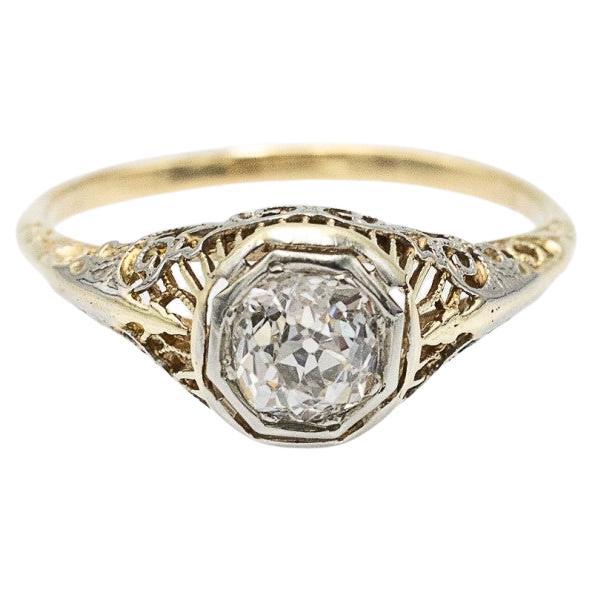 18k gold old-cut solitaire ring with a 0.75ct diamond from around 1900.