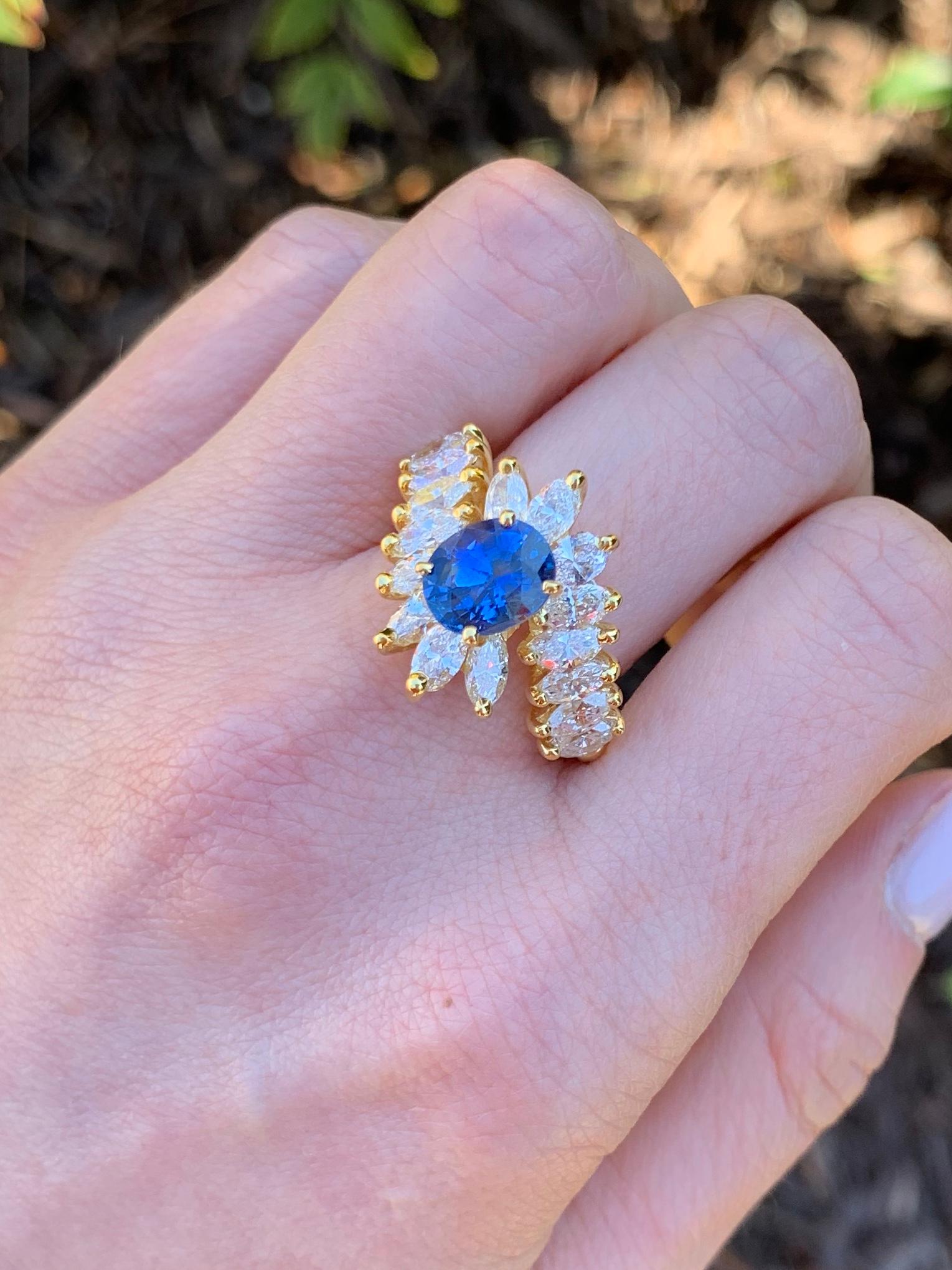 Contemporary 18 Karat Gold Oval Blue Sapphire and Marquise Diamond Cocktail Ring For Sale