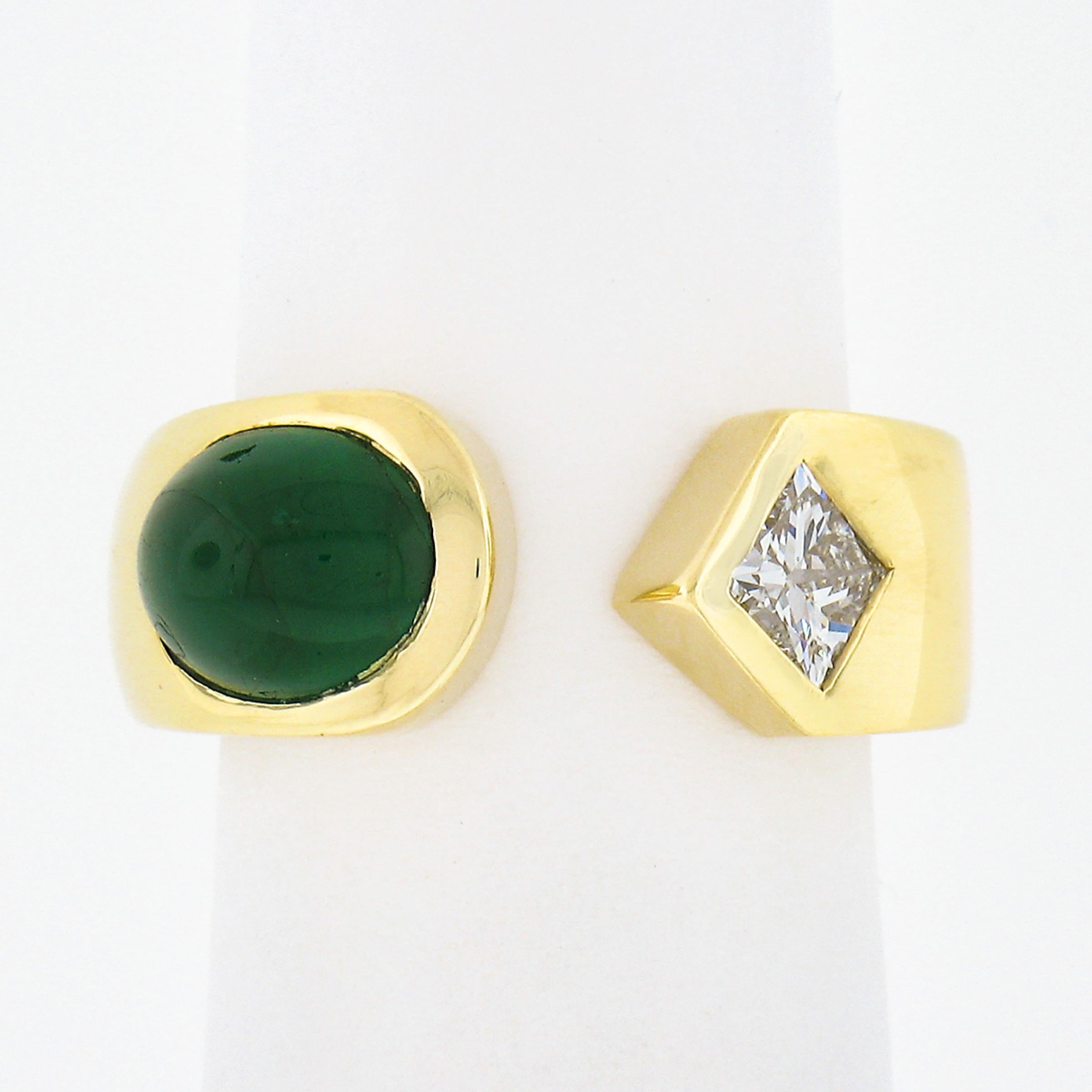 This beautiful and very well made ring is crafted from solid 18k yellow gold featuring an elegant cuff style with an open top that is neatly set with a fine natural emerald stone at one side and a stunning diamond at the other. The oval cabochon cut