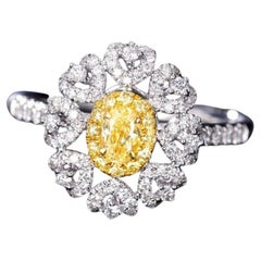 18K Gold Oval Halo Ring with Natural Yellow Diamonds