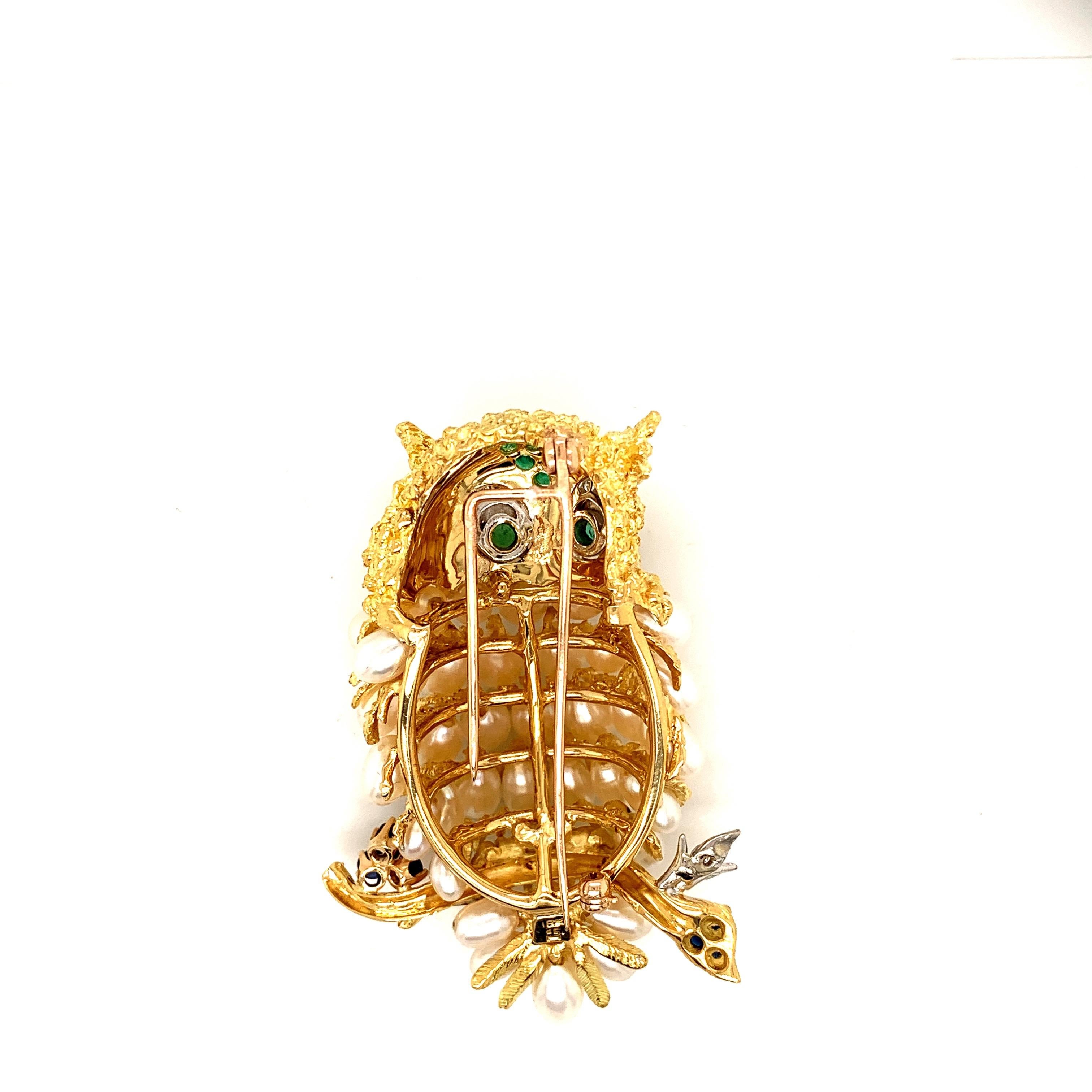 Stunning artistic creation. 
A testament to the imagination,talents,and creativity of the jewelers of yesteryear.
Combining precious gemstones; sapphires diamonds emeralds and pearls this remarkably alive looking owl is a charming find. 
A must add