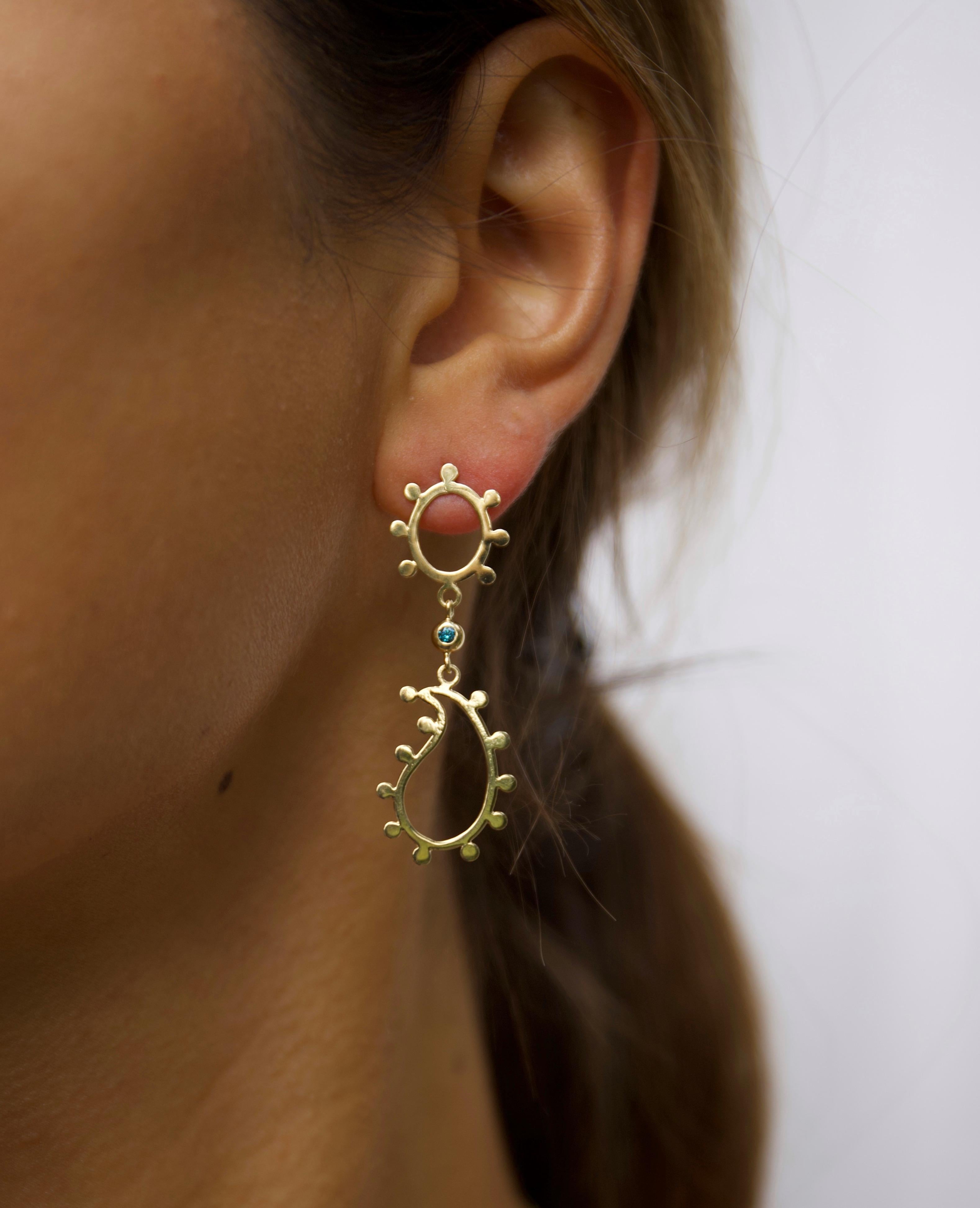 18K gold dangle paisley earrings with an Art Nouveau kind of vibe. The playful and lightweight gold earrings are a timeless addition to your jewelry wardrobe and transition easily from day to night. 
A very versatile piece of jewelry, and the small,