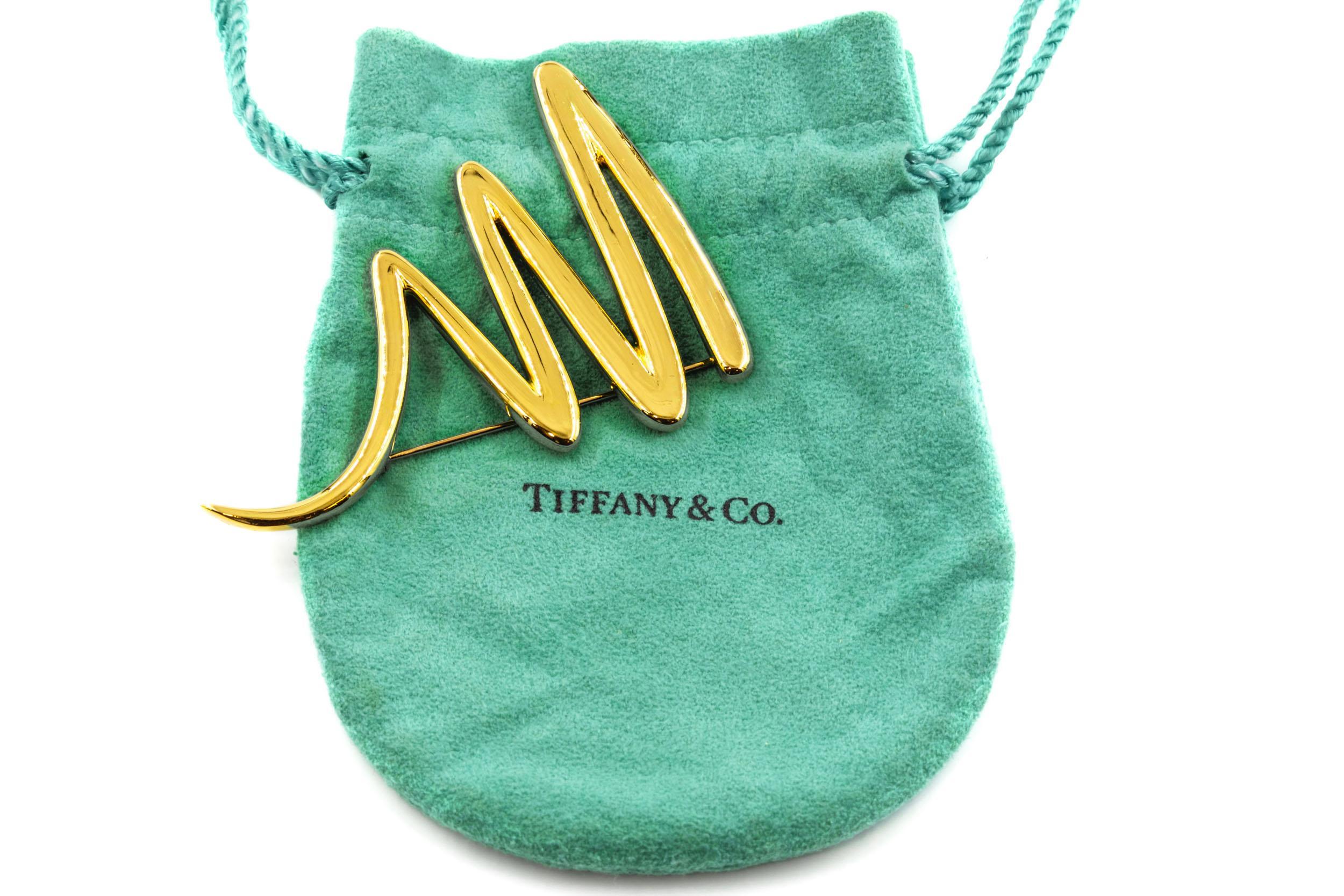 PALOMA PICASSO FOR TIFFANY & CO ZIG-ZAG SQUIGGLE PIN
Circa 1983, with original Tiffany & Co. drawstring pouch
Item # 010SIU17A 

One of the more substantial versions of this iconic design by Paloma Picasso for Tiffany & Co, this version comes in at