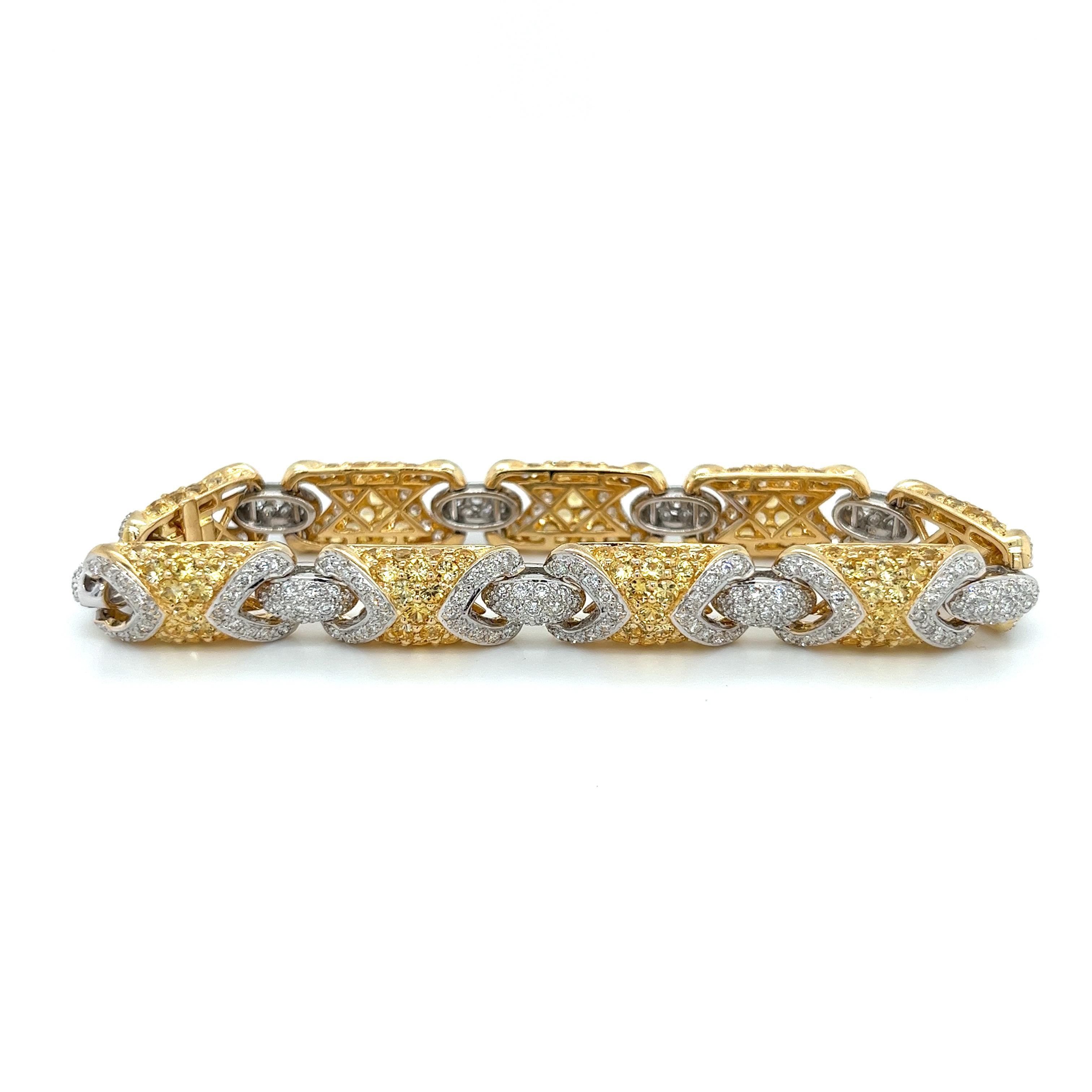Stunning two-tone Yellow Sapphire and Diamond bracelet, masterfully crafted in a mix of 18k yellow and white gold. This exquisite piece features radiant, all-natural yellow sapphires that create an eye-catching pattern, complemented by exceptional,