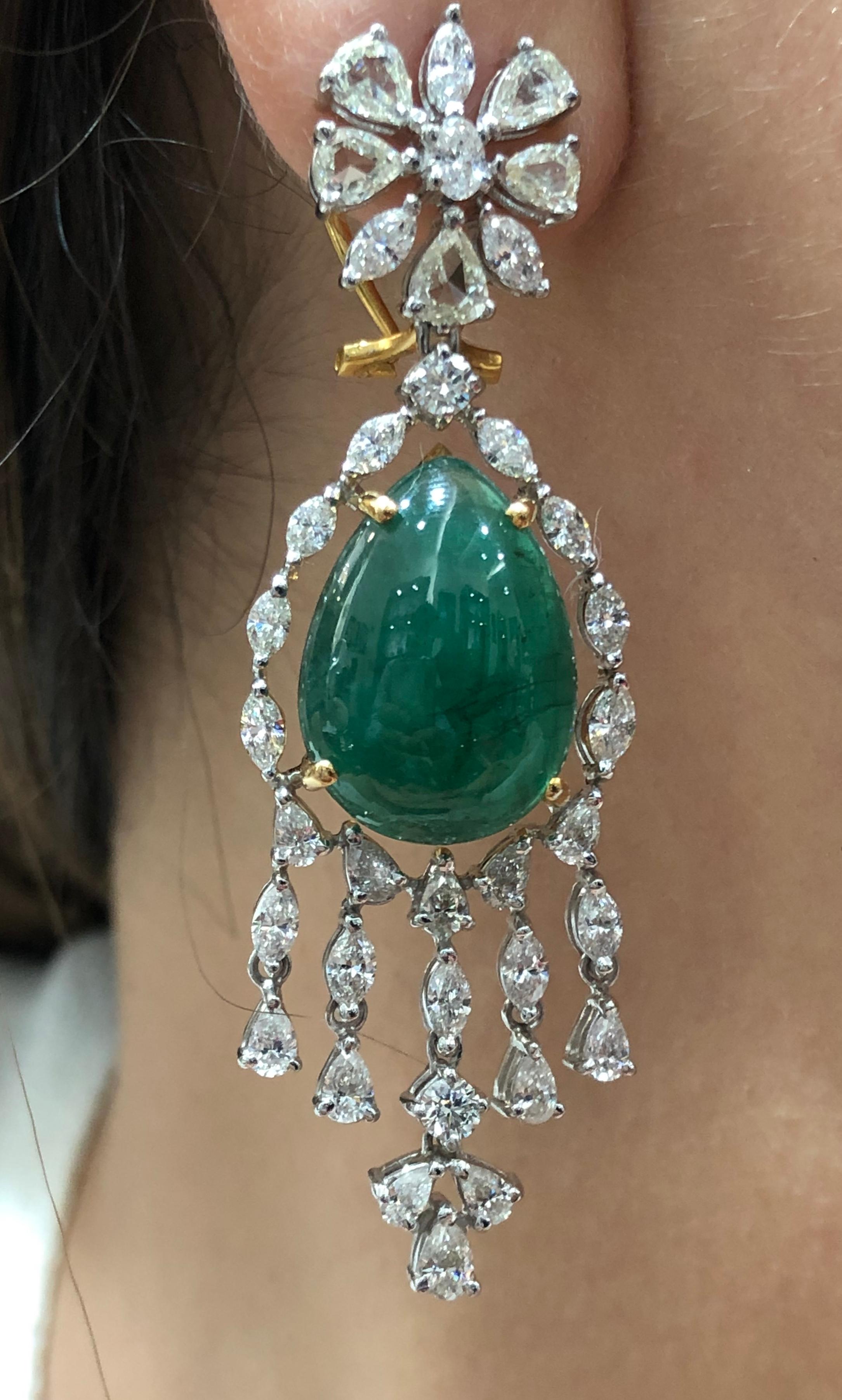 Diamonds: 7.24 carats
Emeralds: 27.35 carats
Gold: 22.010 grams
Ref No: DT - A@CD

Your are bound to shine in these beautiful pair of earrings featuring rose cut diamonds, pear, marquise and round diamonds with Zambian cabochon emeralds
