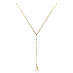 Colgante de oro de 18k con diamante talla pera