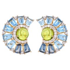 Pendientes de oro de 18 quilates con peridoto cabujón topacio azul baguette diamante noria