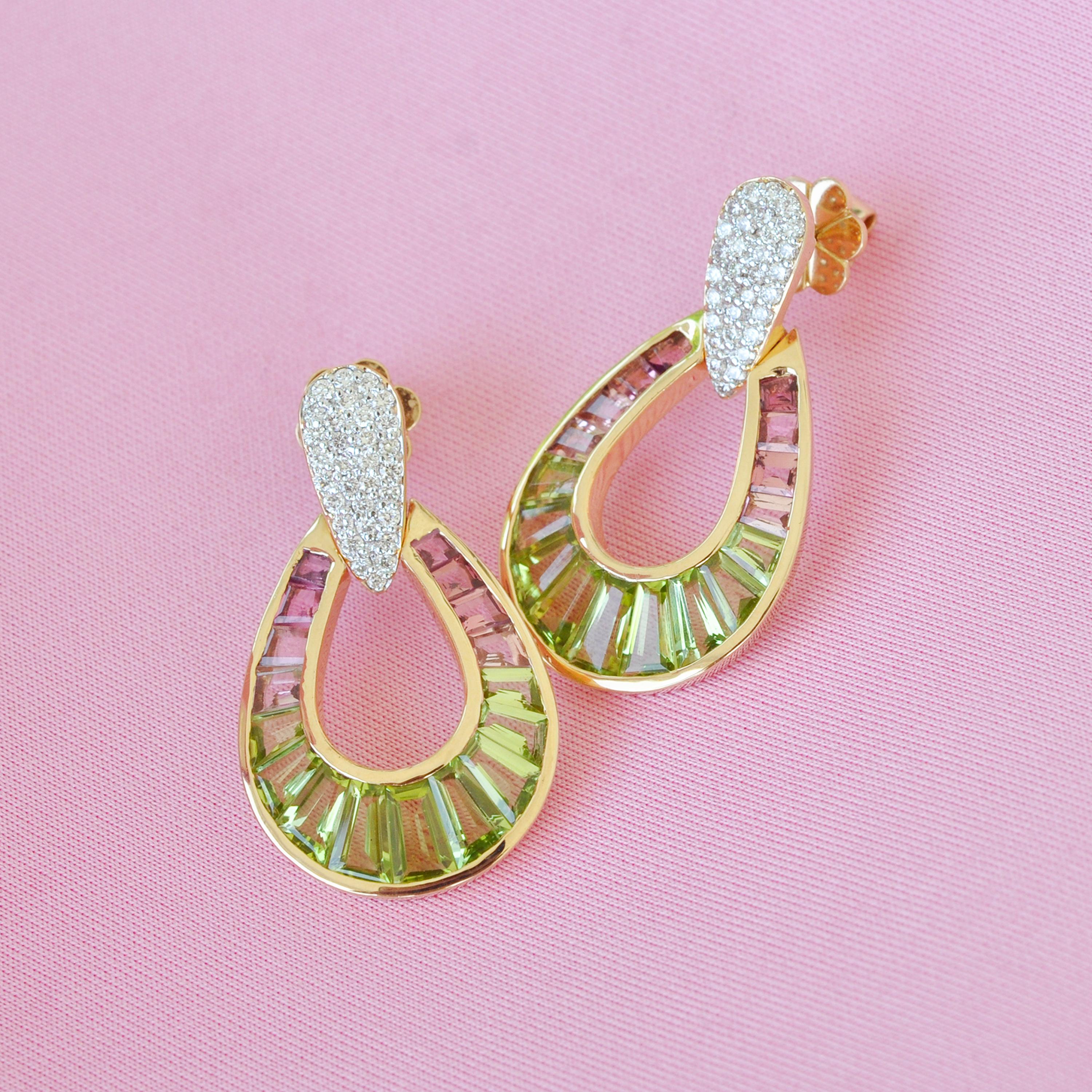 Absolutely stunning, these peridot pink tourmaline dangle drop earrings are set in 18 karat gold using best international alloys. The perfectly crafted tear drop or as some people call it raindrop earrings are made with a lot of work by the experts