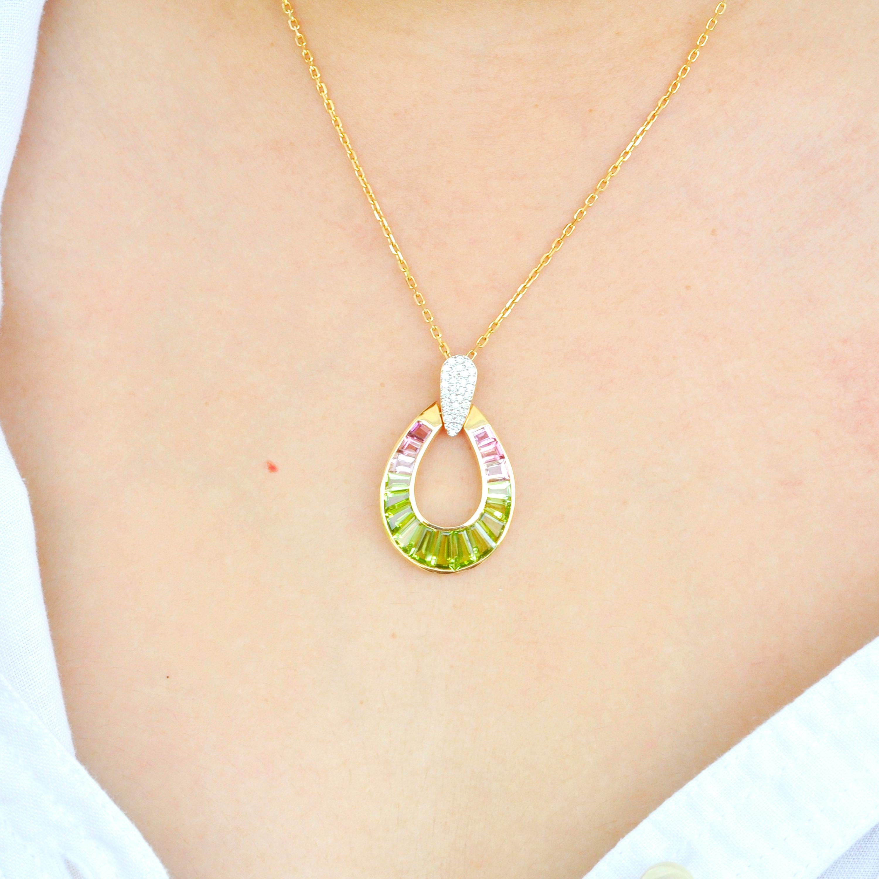 18 karat gold taper baguette peridot pink tourmaline raindrop diamond pendant necklace

Absolutely stunning, this peridot pink tourmaline pendant is set in 18 karat gold using best international alloys. The perfectly crafted tear drop or as some