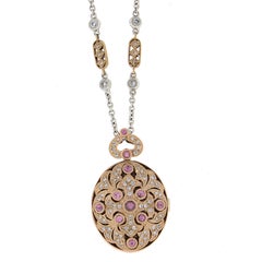 18k Gold Pink Sapphire
Diamond Oval Open Locket Pendant on 15" Link Chain 18k Gold Pink Sapphire
Diamond Oval Open Locket Pendant on 15" Link Chain