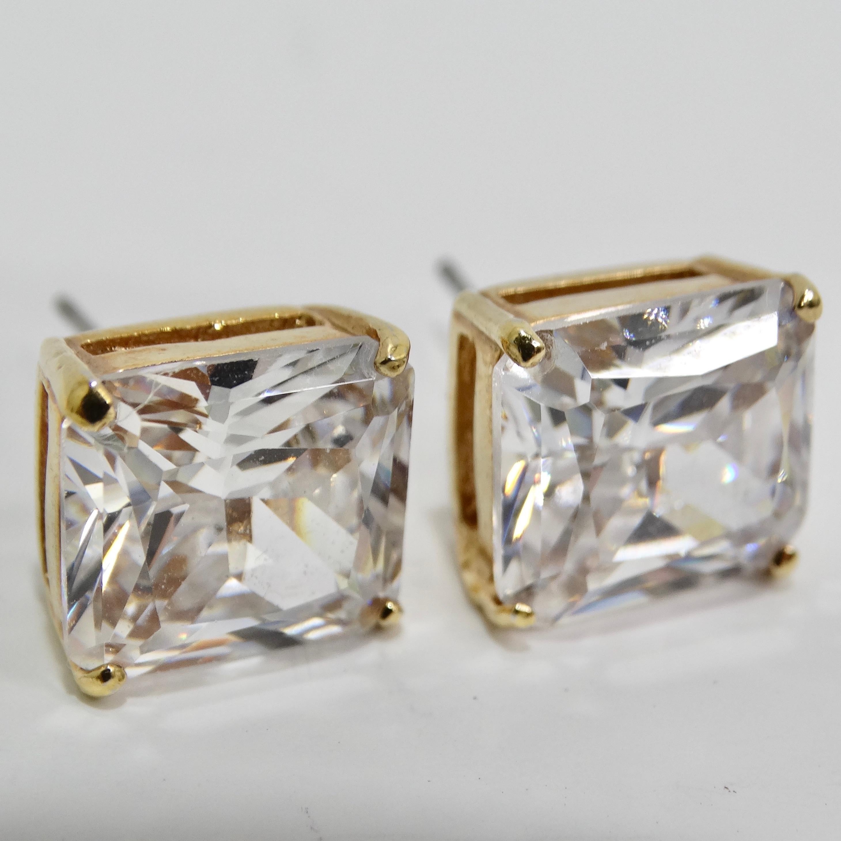 Introducing our stunning 18K Gold Plated Swarovski Synthetic Crystal Stud Earrings, a classic and versatile addition to your jewelry collection. Approximately 5 carats each! These timeless stud earrings feature Swarovski emerald-cut crystals in a