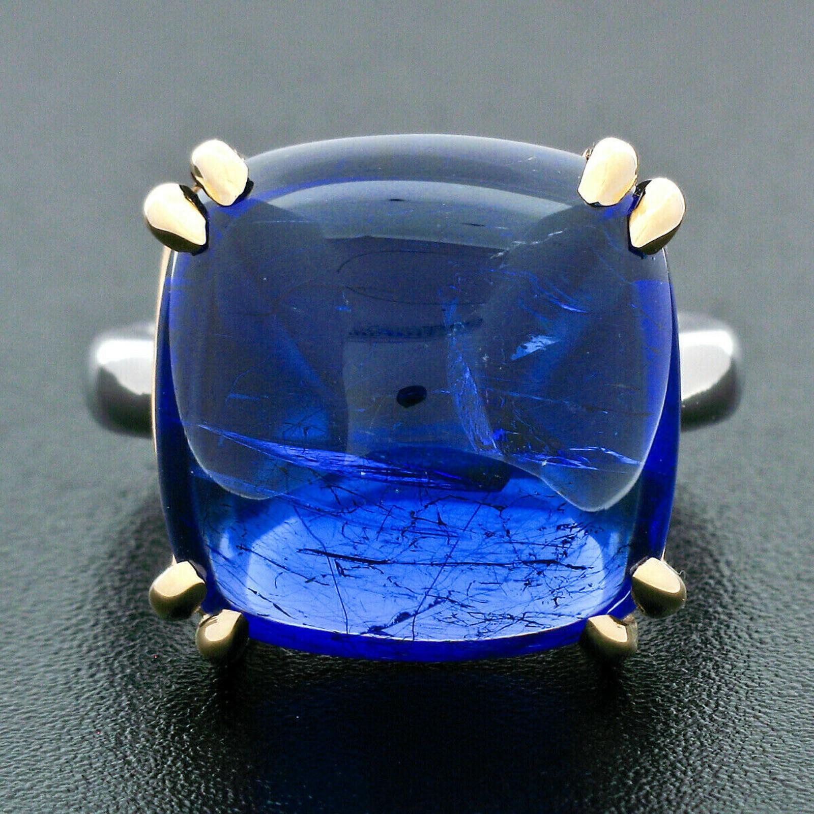 You are looking at a truly fine and breathtaking, GIA certified tanzanite cocktail statement ring hand crafted in solid platinum and 18k yellow gold. The ring features a very fine quality tanzanite solitaire with an outstandingly rich violetish blue