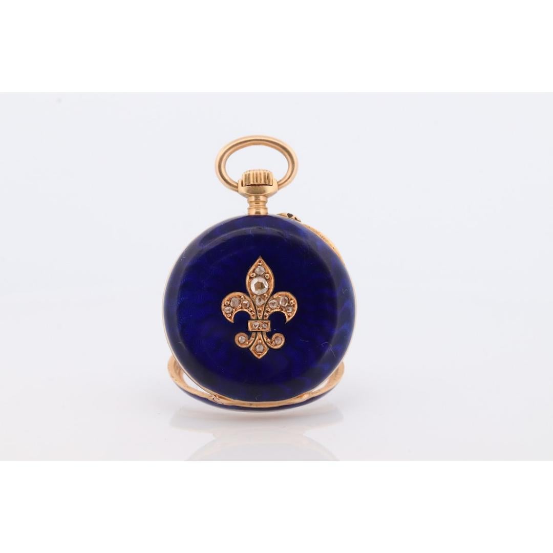 Reloj de bolsillo de oro de 18 quilates. Esmalte azul antiguo con diamantes talla rosa. Flor de Lis Corte rosa
