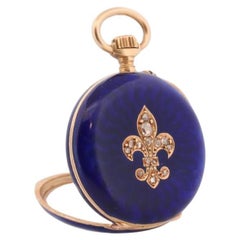 Reloj de bolsillo de oro de 18 quilates. Esmalte azul antiguo con diamantes talla rosa. Flor de Lis