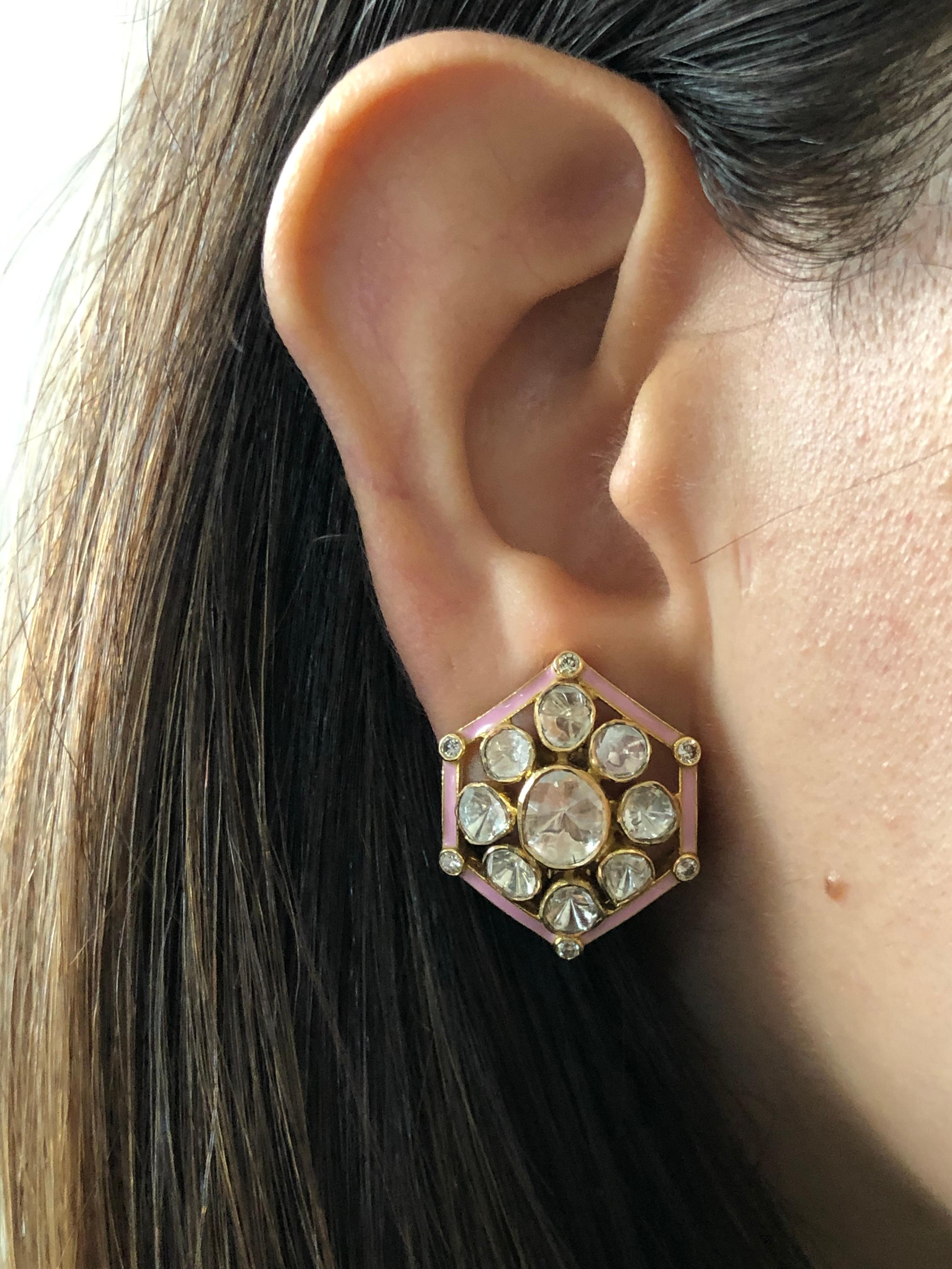 Diamond: 2.30 carats 
Gold: 11.850 grams 18k
Item Code: DT-IAG
Note: These earrings can also be made in different enamel colours: Turquoise and Ivory 


Hints of Pastel Pink! Our beautifully handcrafted stud earrings featuring polki diamonds with