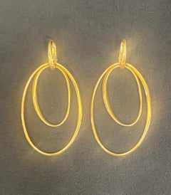 18k gold Pomellato large elliptical hoop earrings