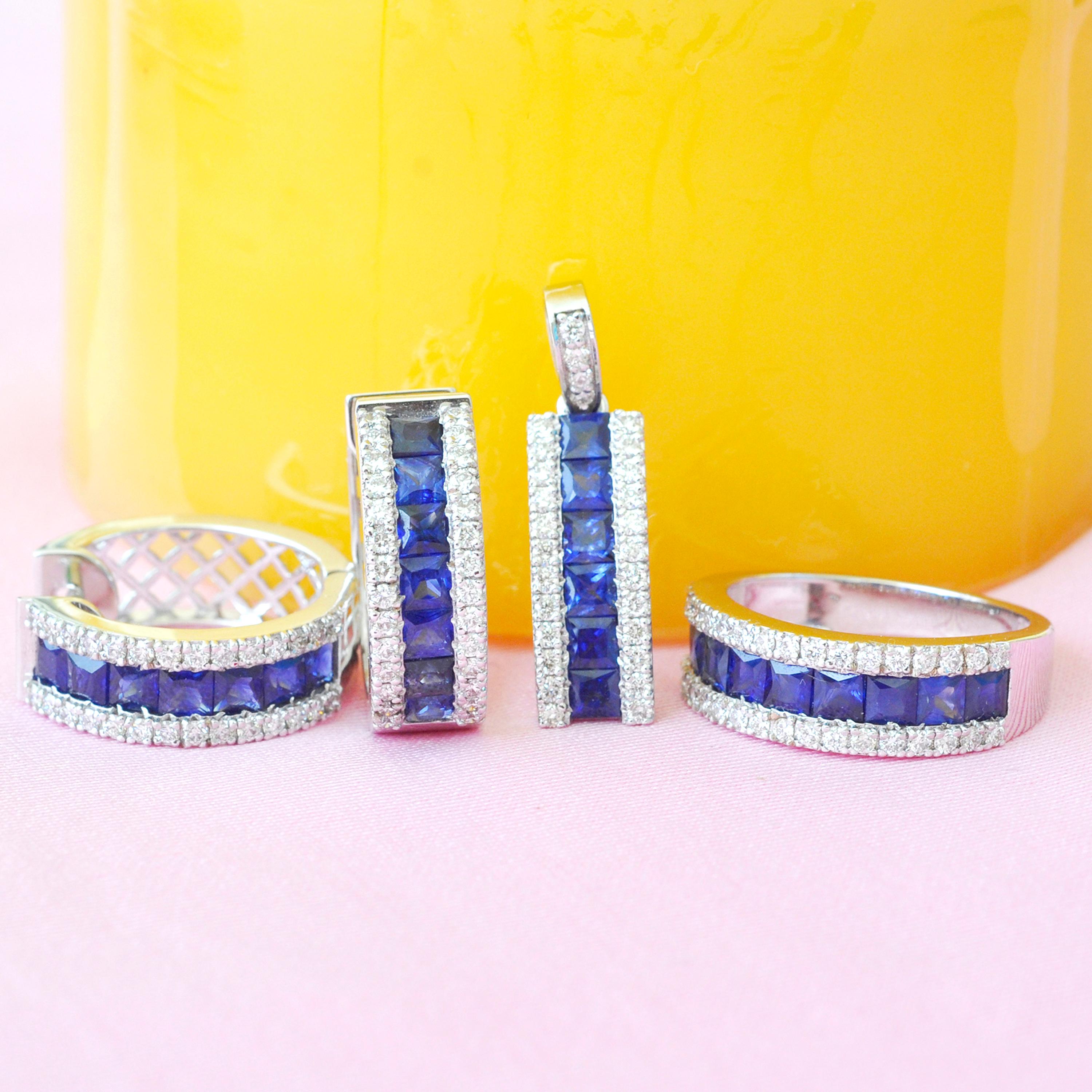 18 karat gold channel set princess cut blue sapphire diamond linear pendant hoop earrings ring set

The enchanting set with the vibrant blue sapphires incorporated within an equivalent layer of micro pave set diamonds on either side is distinctive