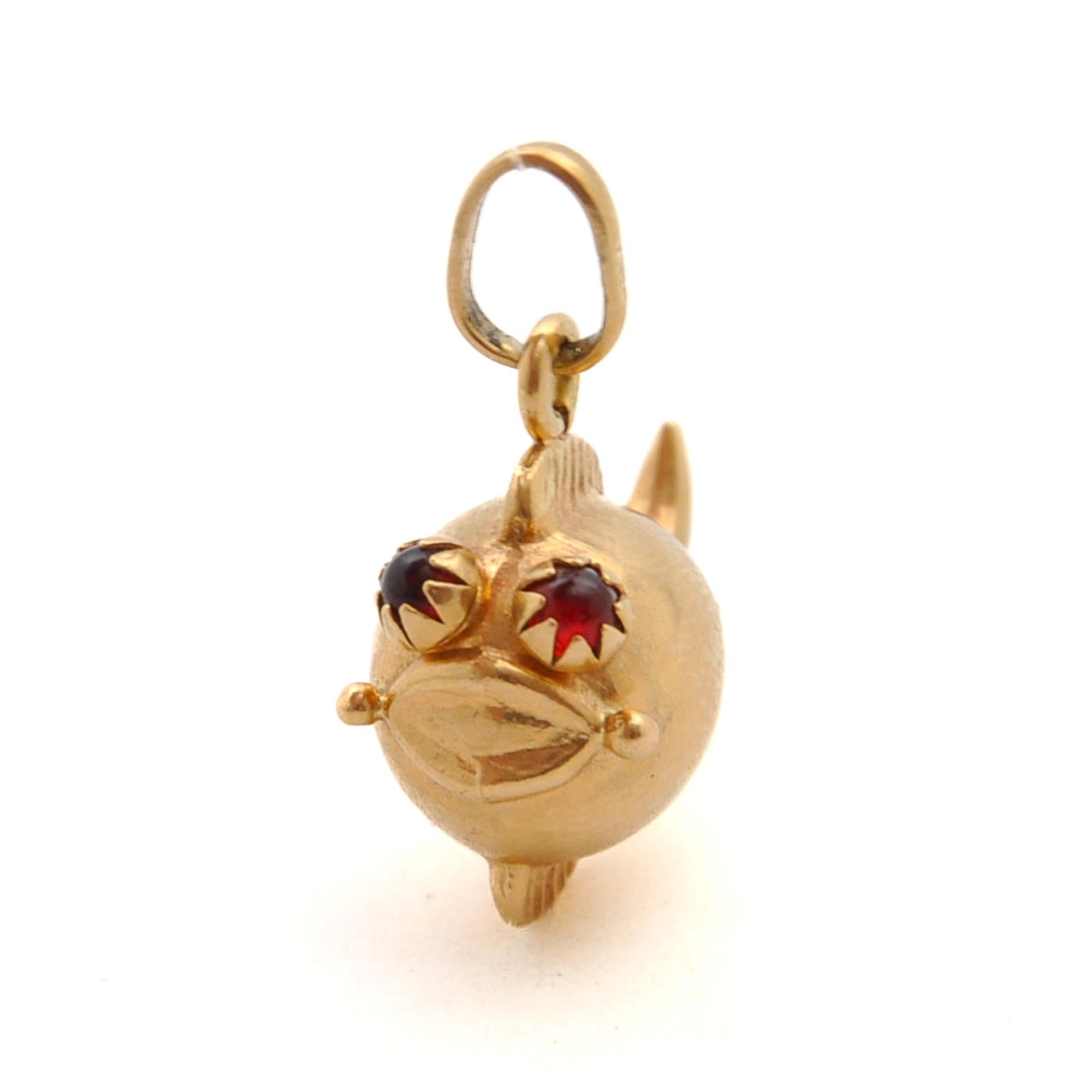 An 18 karat yellow gold puffer blow fish charm pendant. The fish is lovely and created with red stone eyes, the puffy body is highly polished, while the fins and tail are beautiful engraved and detailed. 

Collect your own charms as wearable