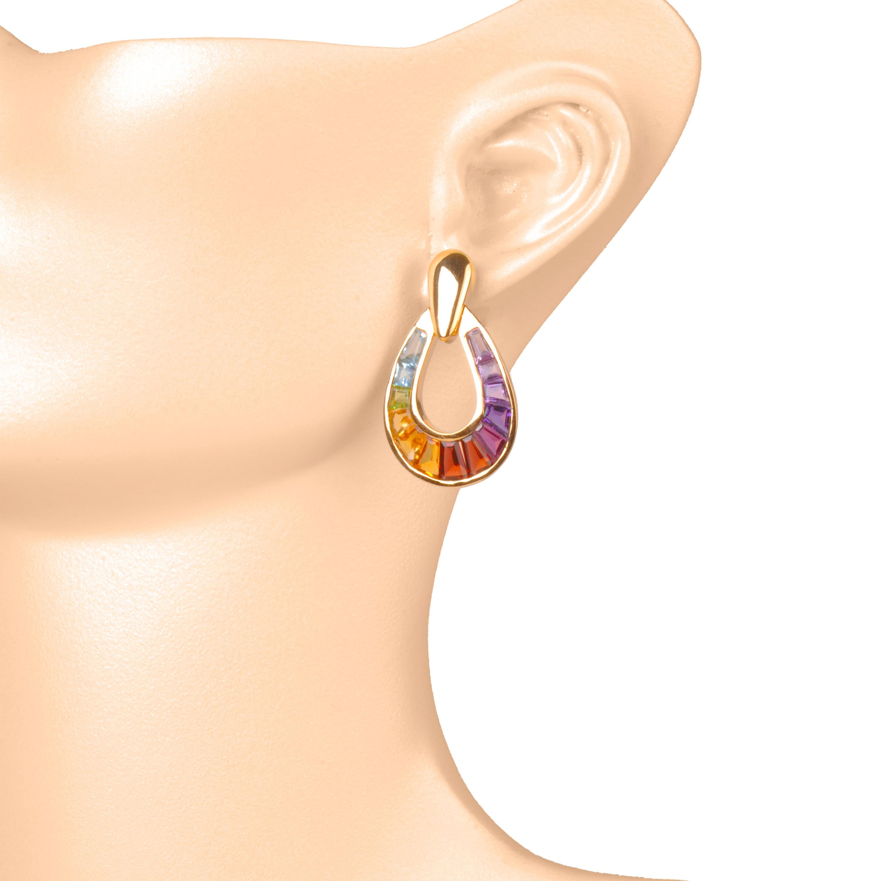 18k gold raindrop channel-set rainbow taper baguette gemstones dangle earrings

Immerse yourself in a world of enchantment with our stunning multicolor raindrop earrings. A fusion of art and color, these earrings are a breathtaking display of