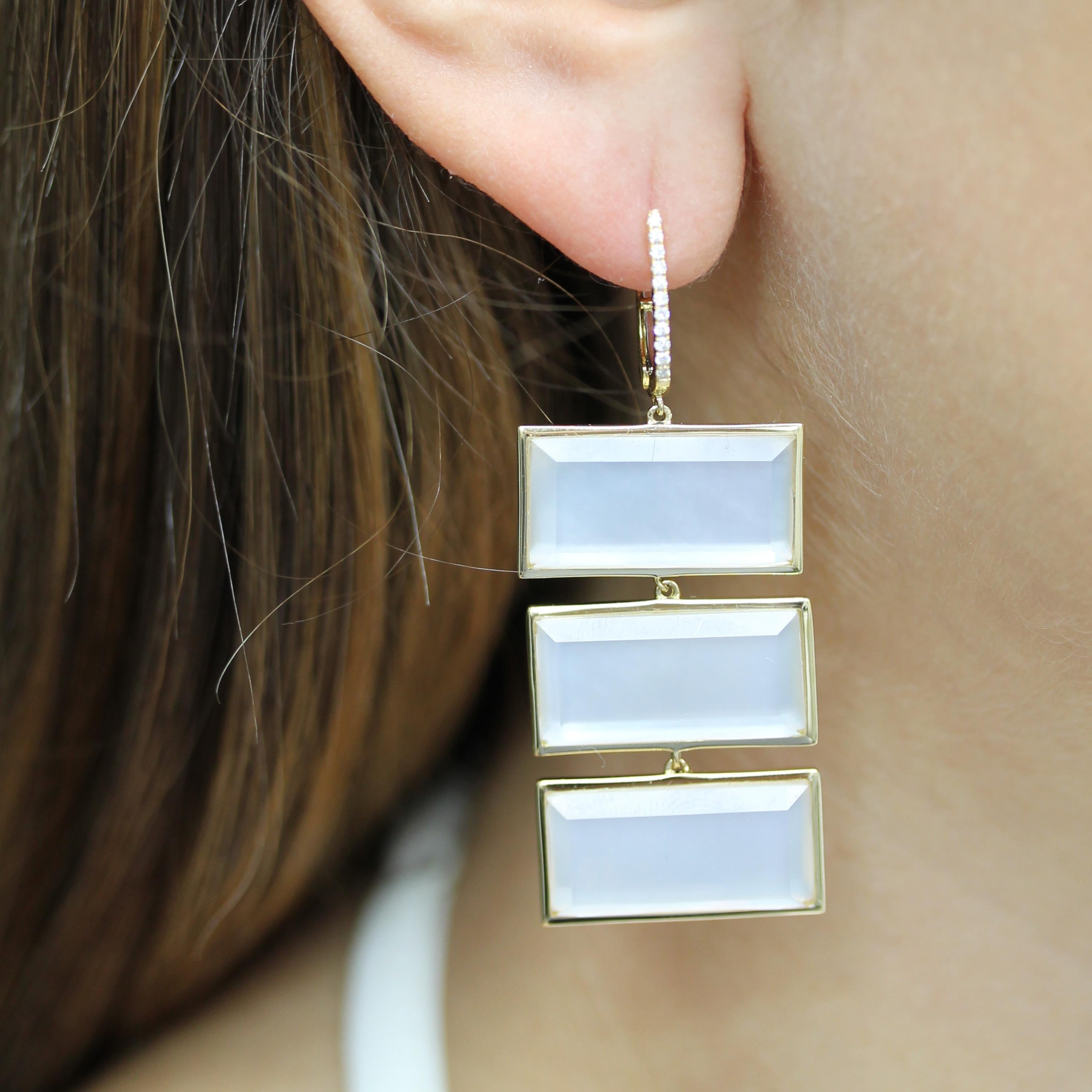 White Orchid Collection Earrings, with (3) Rectangular White Mother of Pearl and White Quartz Doublets, and gold diamond huggie-tops, in 18K yellow gold. White mother of pearl comes from the inner lining of oyster shells, and is believed to promote