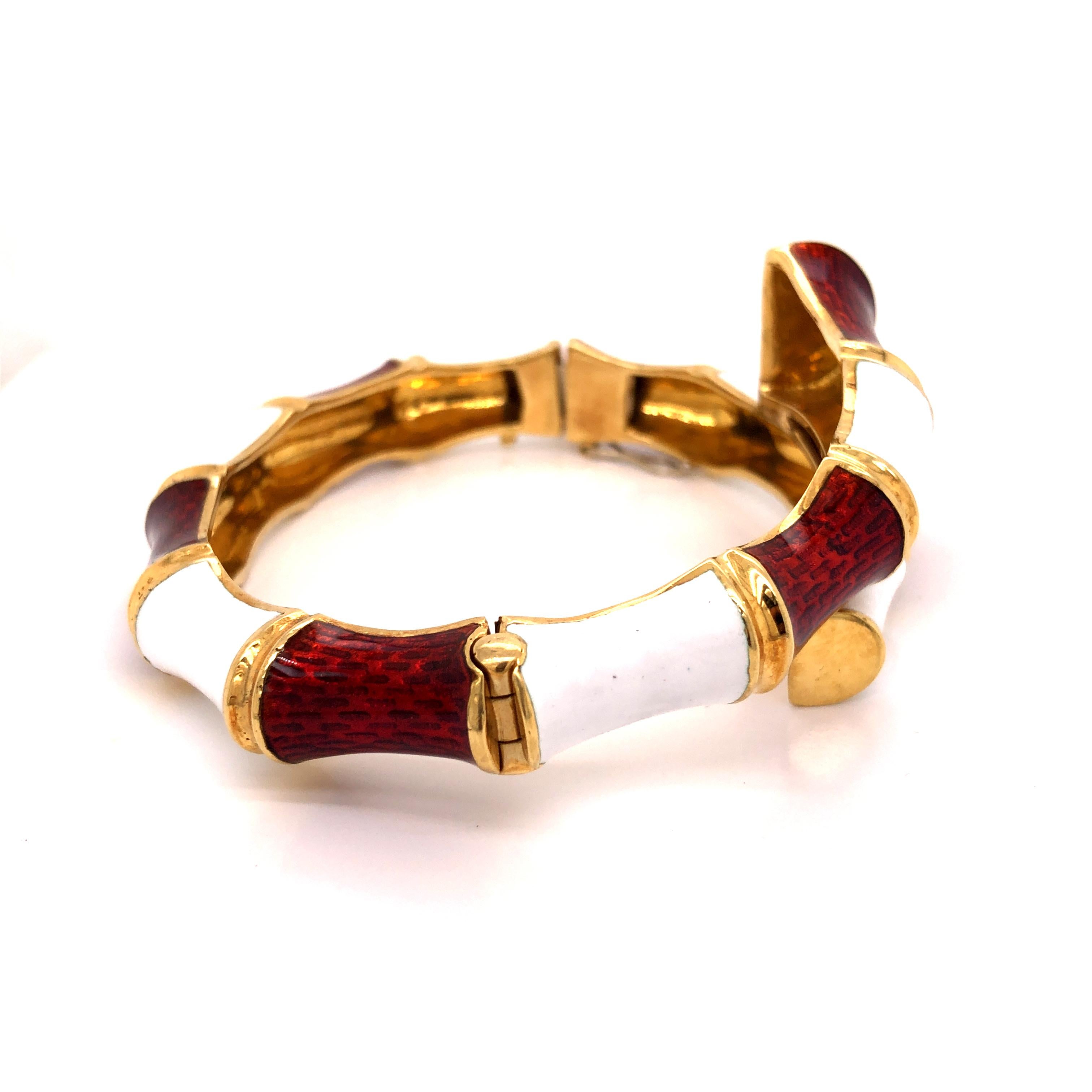 A cool vintage white and red enamel bamboo bangle bracelet. 
18K Yellow Gold

Inside Measurement: 2 3/8