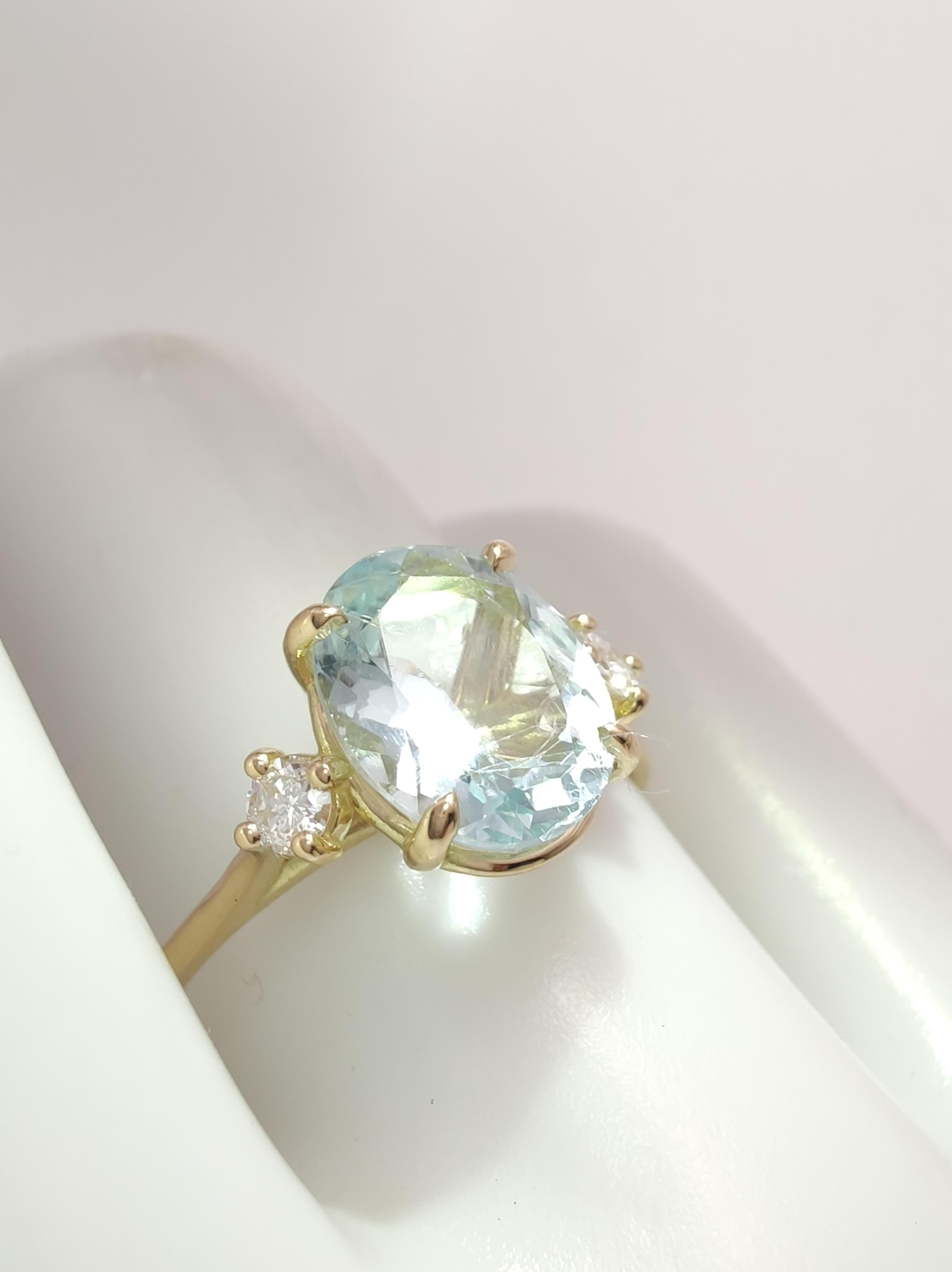 Handcrafted Elegance: Exquisite 18K Gold Ring Featuring Stunning Gemstones

Elevate your style with our handcrafted 18K gold ring for women, showcasing a timeless design with a central 1.6ct oval cut aquamarine and two 0.13ct diamonds. Discover