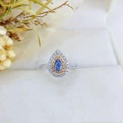 18K Gold Ring Rare Teardrop Cut Blue Diamond Encircled by Dazzling Halo