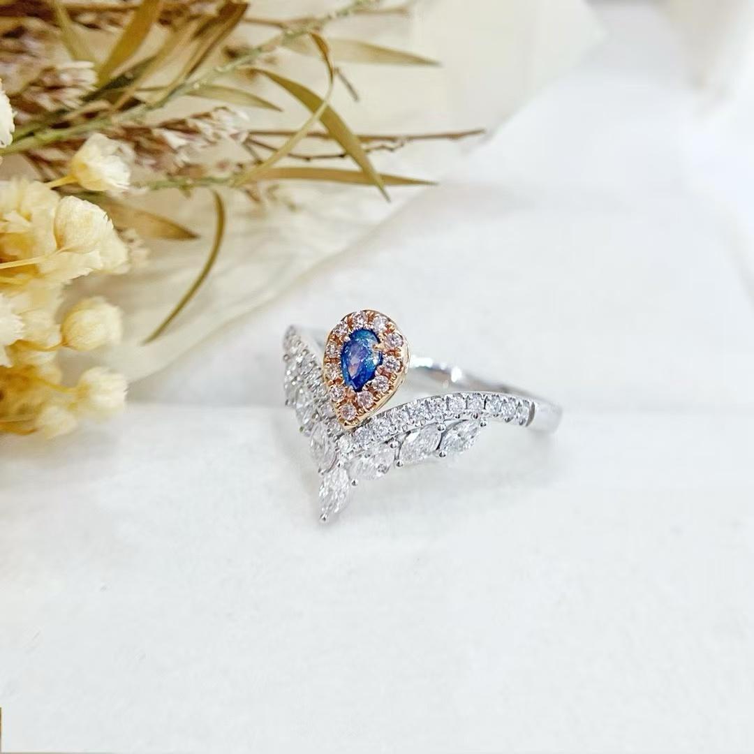 18K Gold Ring Teardrop Shaped Blue Diamond with V Shaped Marquise Design

Main stone D - 0.13 CT
Side Stone D - 0.48 CT 
Total Weight - 3.36 GM

Eye - catching Centerpiece: A vivid teardrop - shaped blue diamond as the focal point, exuding