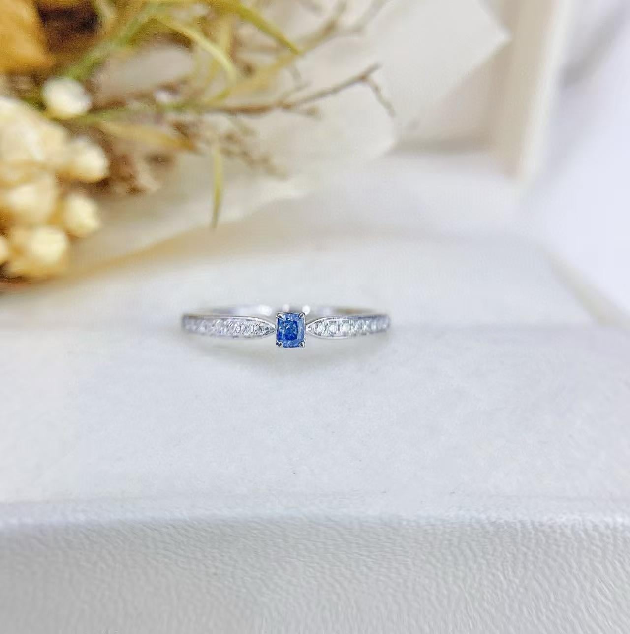 18K Gold Ring with Cushion Cut Blue Diamond

Main stone D - 0.08 CT
Side Stone D - 0.08 CT 
Total Weight - 1.5 GM

Eye - catching Centerpiece: The ring features a cushion - cut blue diamond as the focal point. The distinct cut of the diamond