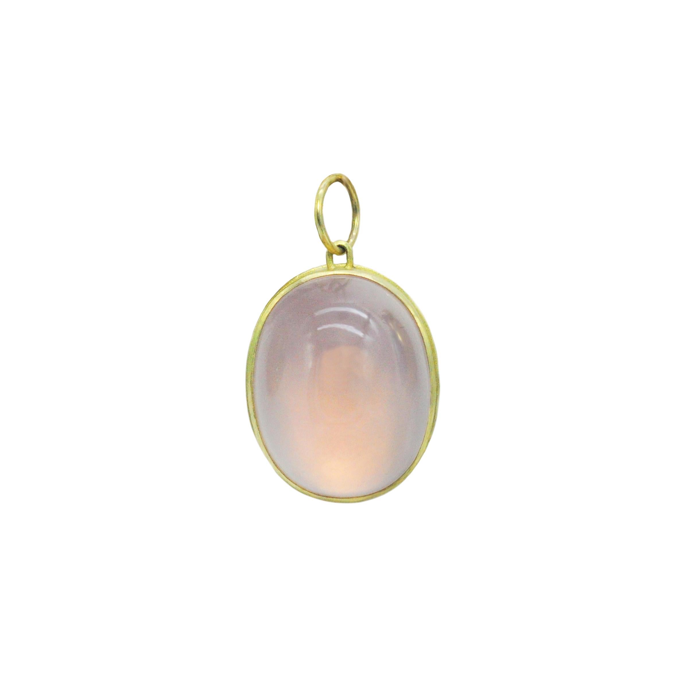 You'll love this colorful charm necklace with designer flair! The botanical gemstone necklace is comprised of a large oval rose quartz pendant set in 18k gold. A star passes over the surface of this soft powder pink beauty. The pendant is paired