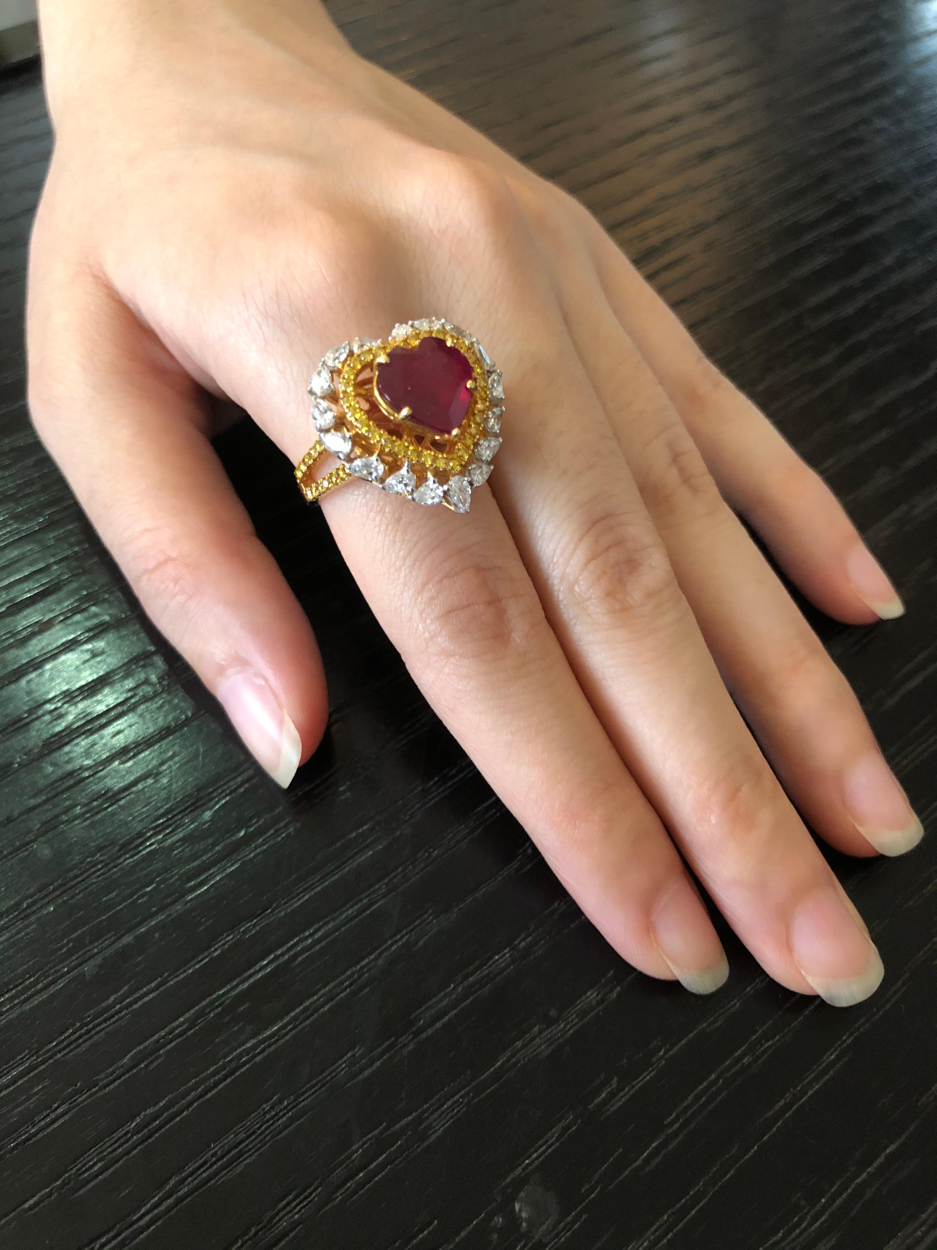 Diamond: 1.58 carats 
Ruby 3.26 carats 
Gold: 9.022 grams 18k
Ring Size: 6.5 US 
Item Code: DR-HCD

Rubies spell romance and elegance!
One can't help fall in love with this breathtakingly striking heart shaped ruby ring studded with natural fancy