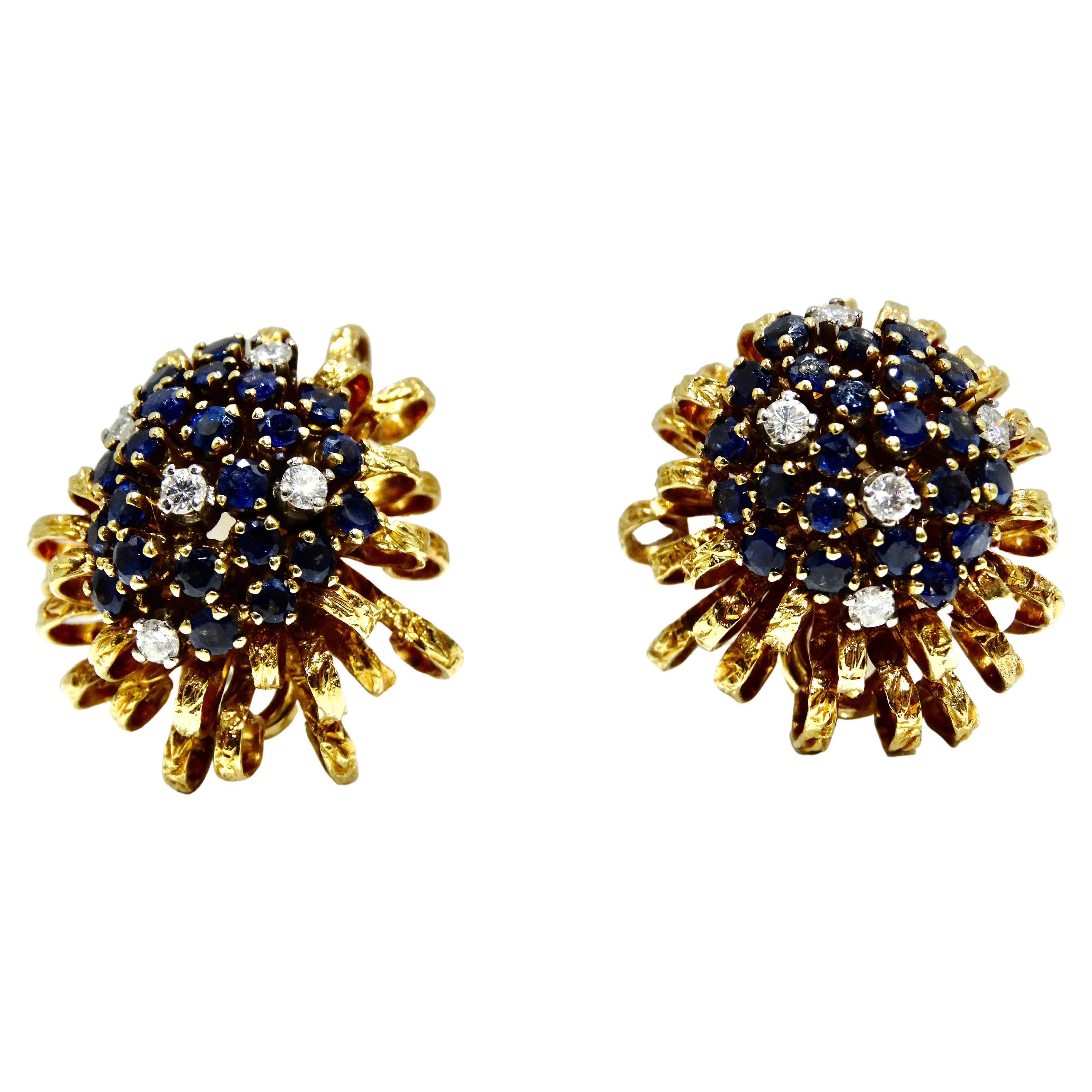 Impressive ribbon wedged heirloom 18k gold clip-ons featuring a sparkling cluster of Montana sapphires enhanced by several diamonds. Additional ribbon wedges of textured gold form the lower layer of these free flowing festive jeweled earrings.
Each