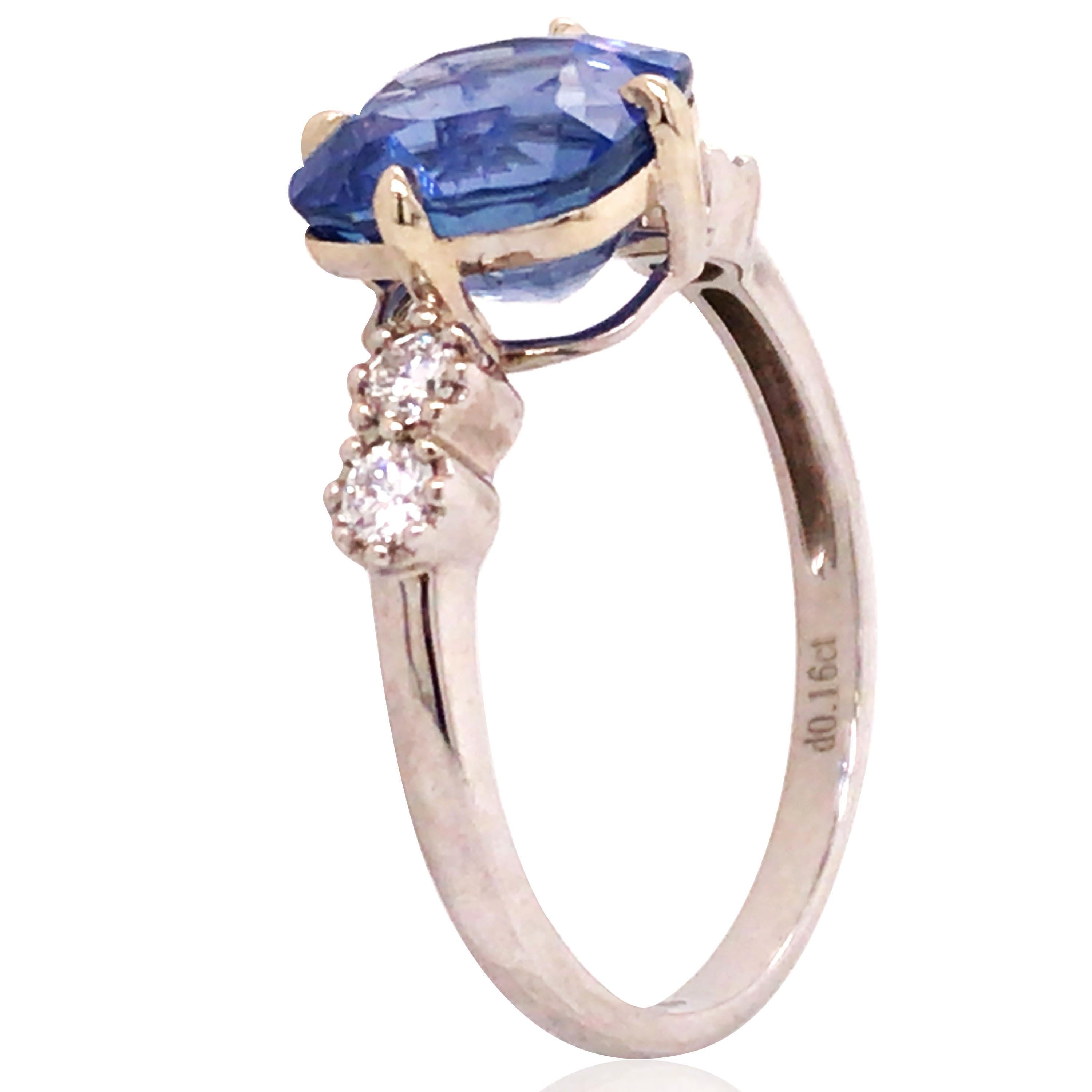 Cushion-shaped sapphire weighs 3.24ct, accompanied by a Gubelin report stating the sapphire is of Burma origin with no indication of heating. 4 round diamonds total approx. 0.16ct. Ring size: 5.75. 

Weight: 1.7 grams