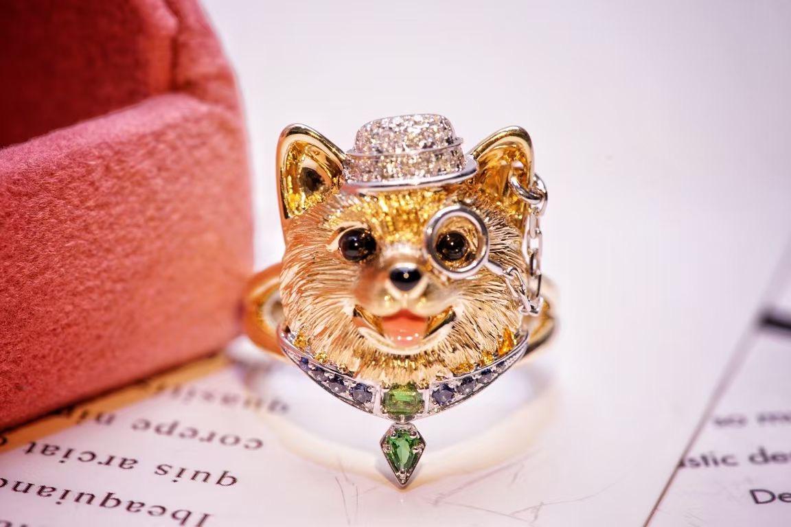 18K Gold Sapphire & Diamond & Tsavorite ‘Dog' Ring 

Diamonds - 0.132 CT
Blue Sapphire & Tsavorite

Total Weight - 9.79 GM