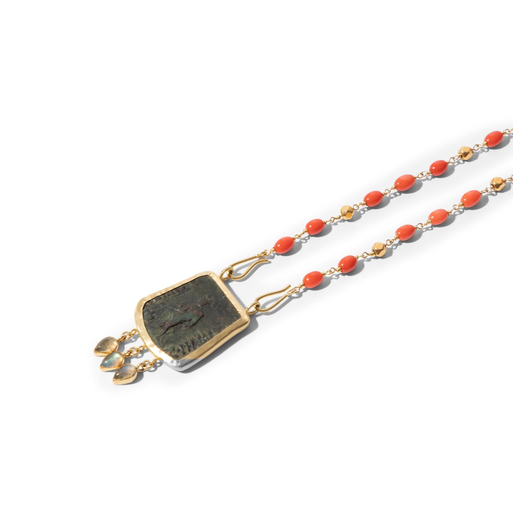 One of a kind necklace with delicate coral and gold beads wire-wrapped on gold wire. The detachable antique coin with an image on both sides is enhanced with a small fringe of labradorite drops.  This unique and versatile necklace which can be worn