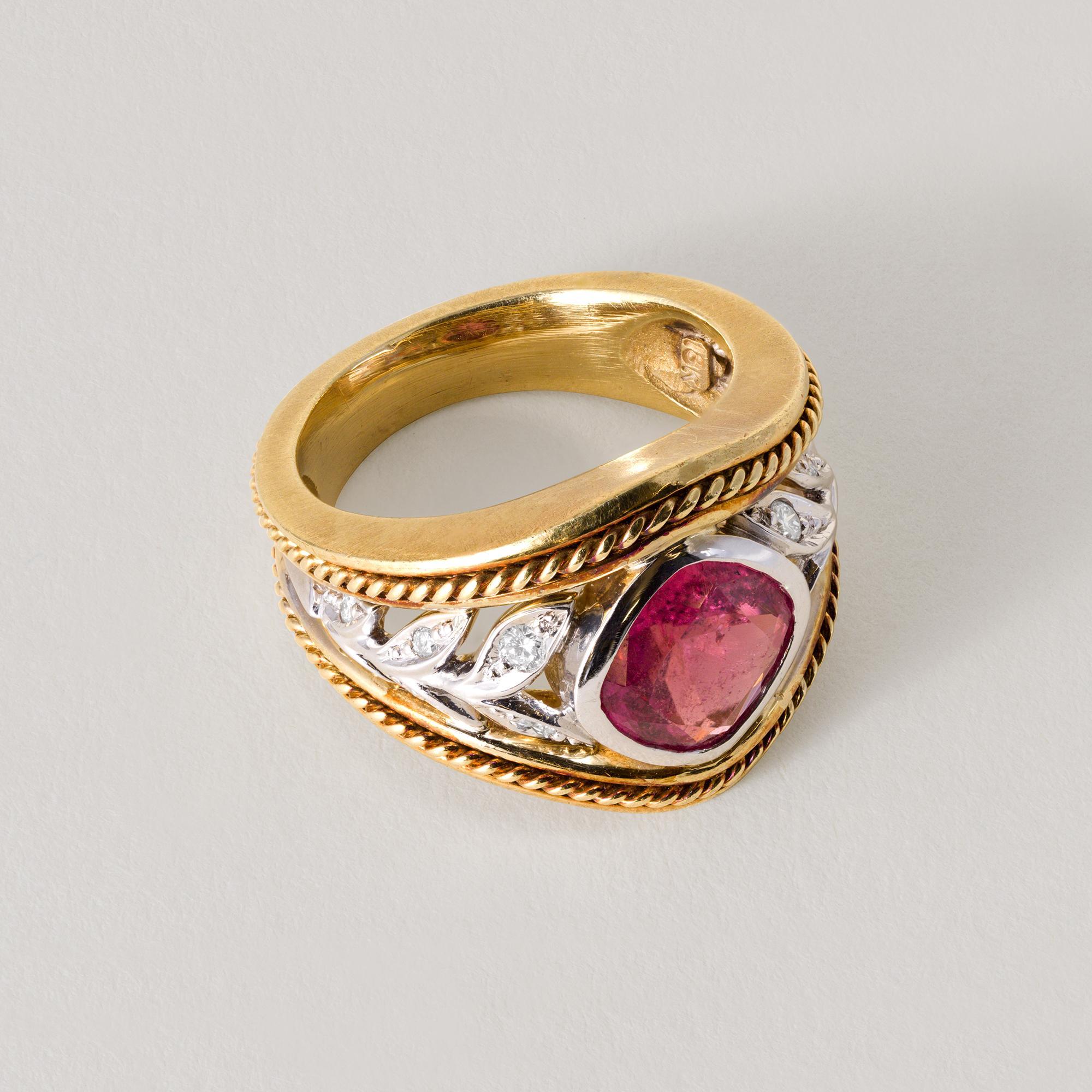 This is signed Seidengang tourmaline ring in 2 tone 18k gold.
Details:
Cushion-cut pink tourmaline
weighs ~3 carat, bright and vivid pink
12 round brilliant champagne color diamonds
18k yellow gold 2 tone
ring size 6.5
12.7 grams total