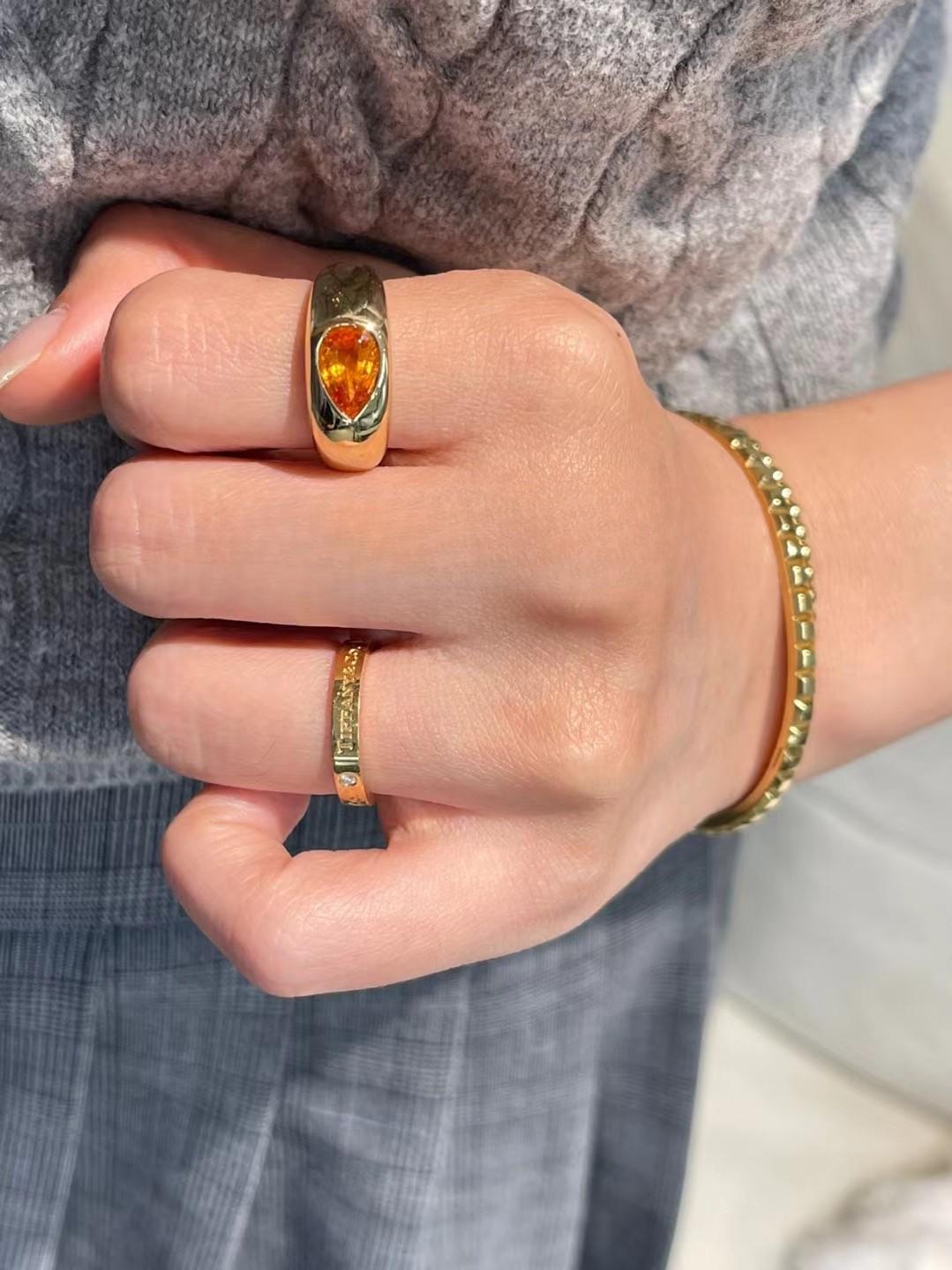 1.78 Carat Vivid Orange Fanta Garnet 18K Gold Ring

Main stone - 1.78 CT
Total Weight - 7.32 GM

Premium Material: Crafted from 18K gold, ensuring durability and a luxurious shine.
Eye - catching Gemstone: Features a 1.78 - carat drop - shaped Fanta