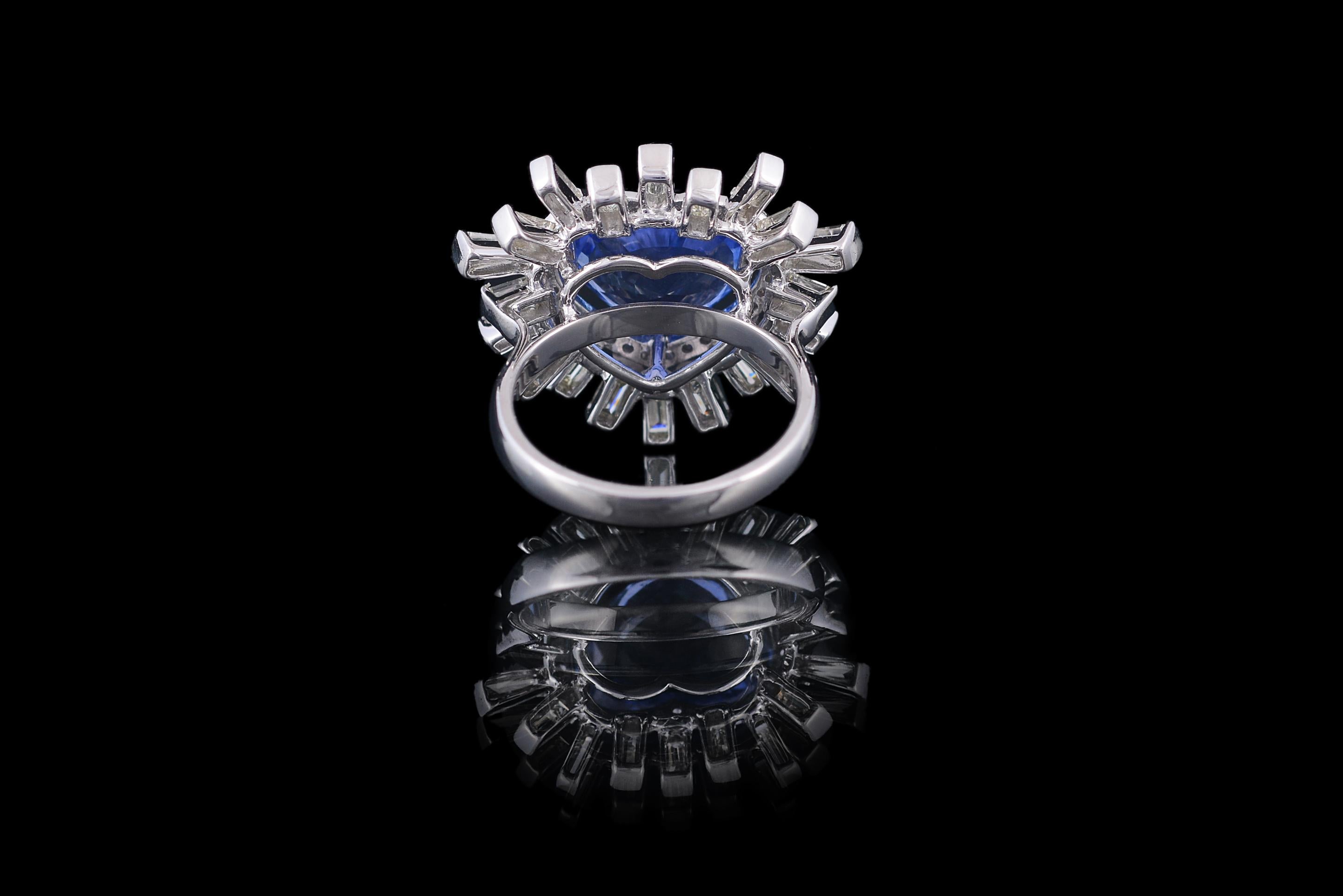 Gorgeously set in 18K white gold, a 6.06 carats blue sapphire and baguette diamonds cocktail ring. The Sapphire is from Sri Lanka and weighs 6.06 carats. The weight of the baguette diamonds is 1.59 carats. The ring is made in Indian ring size 12 (US